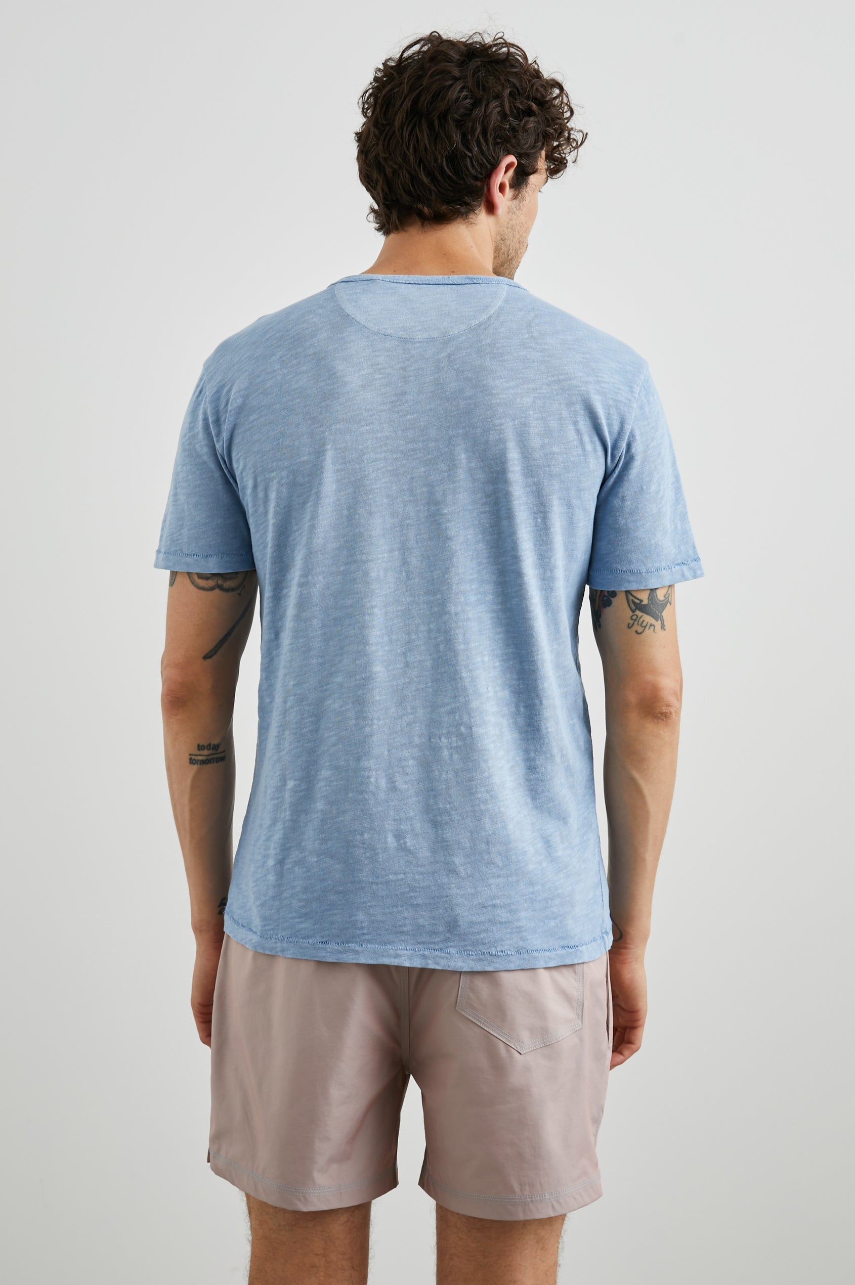 Skipper Short-Sleeve T-shirt with a Crew Neck and a Chest Patch Pocket in Celsius Colorway, a Blue - Back View Featured on Model