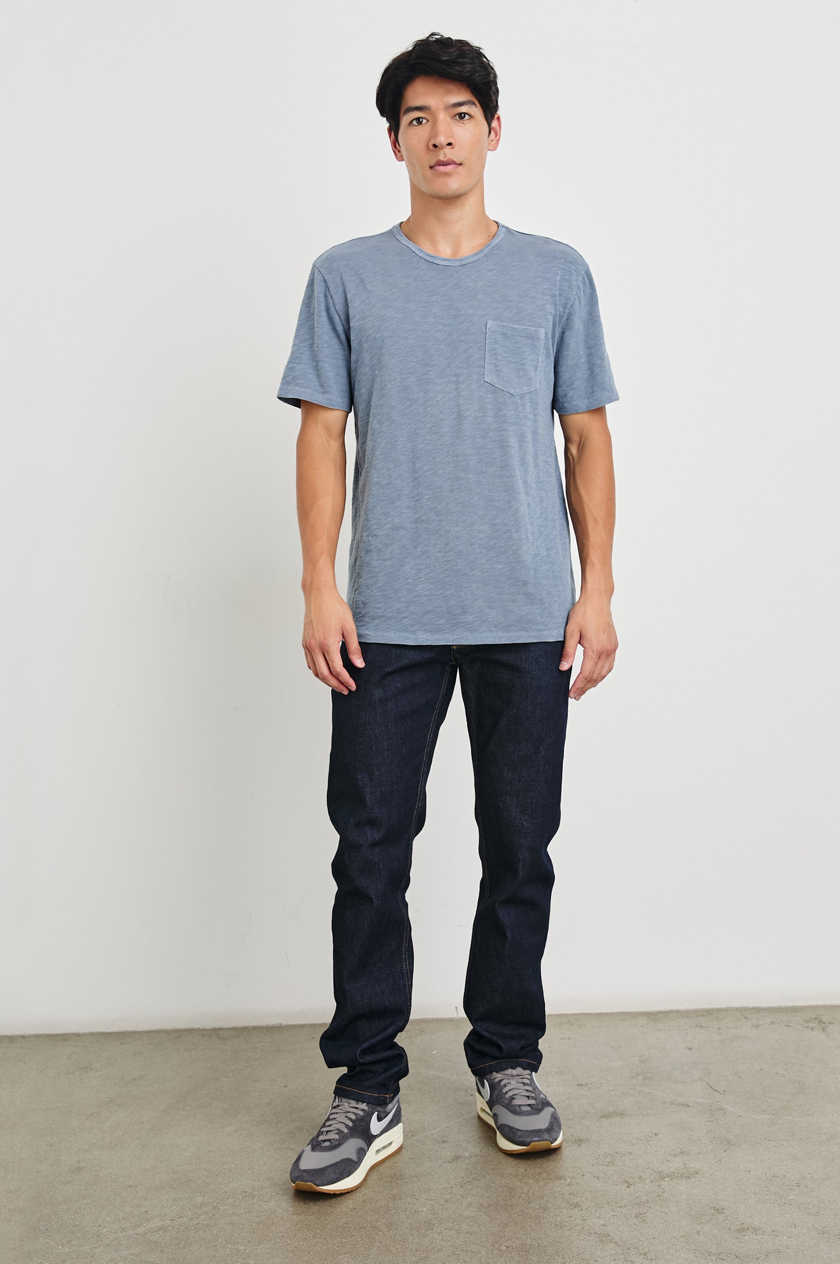Skipper Short-Sleeve T-shirt with a Crew Neck and a Chest Patch Pocket in Steel Colorway - Front Full Body View Featured on Model