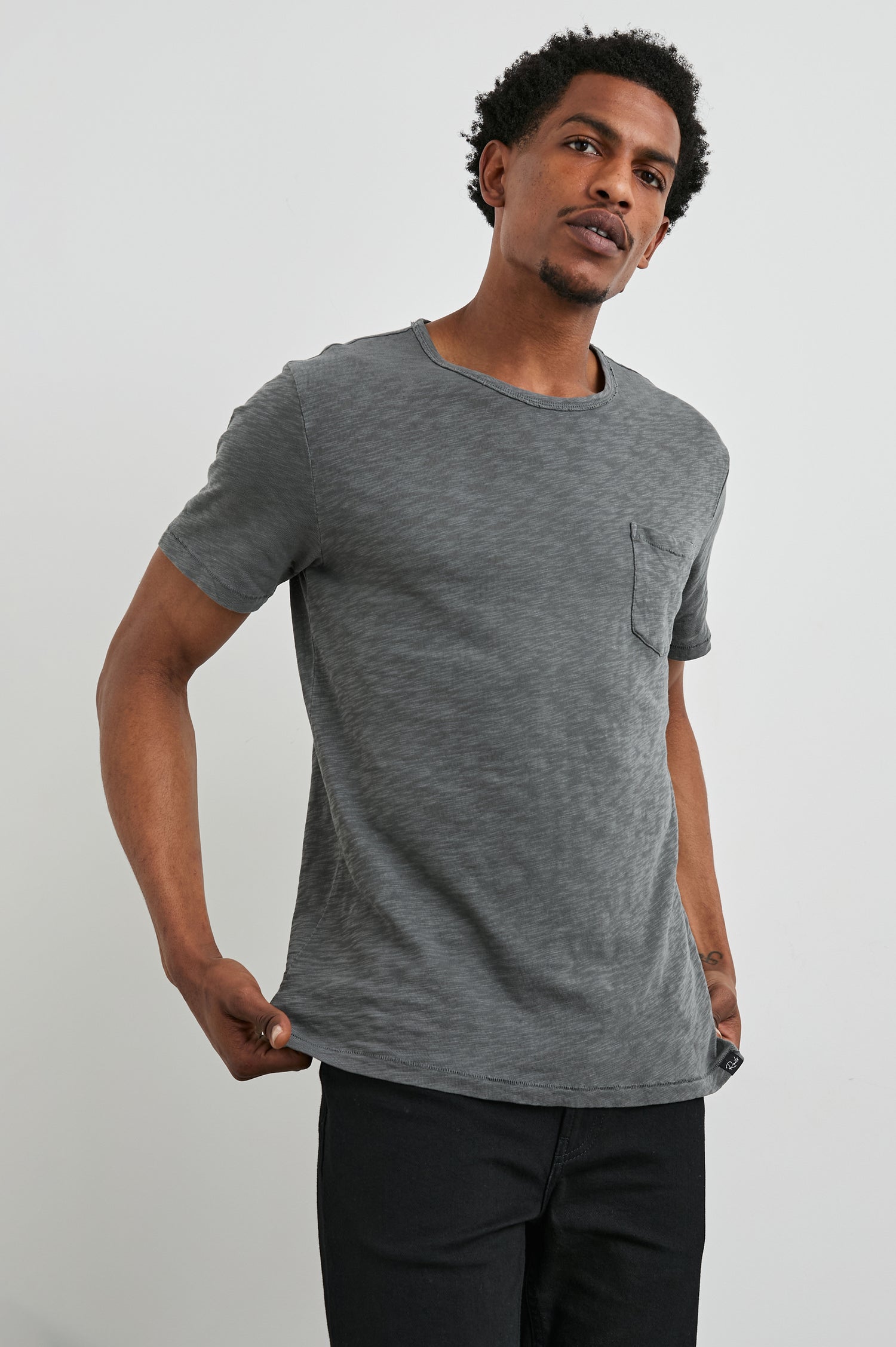 Skipper Short-Sleeve T-shirt with a Crew Neck and a Chest Patch Pocket in Washed Black Colorway - Front View Featured on Model