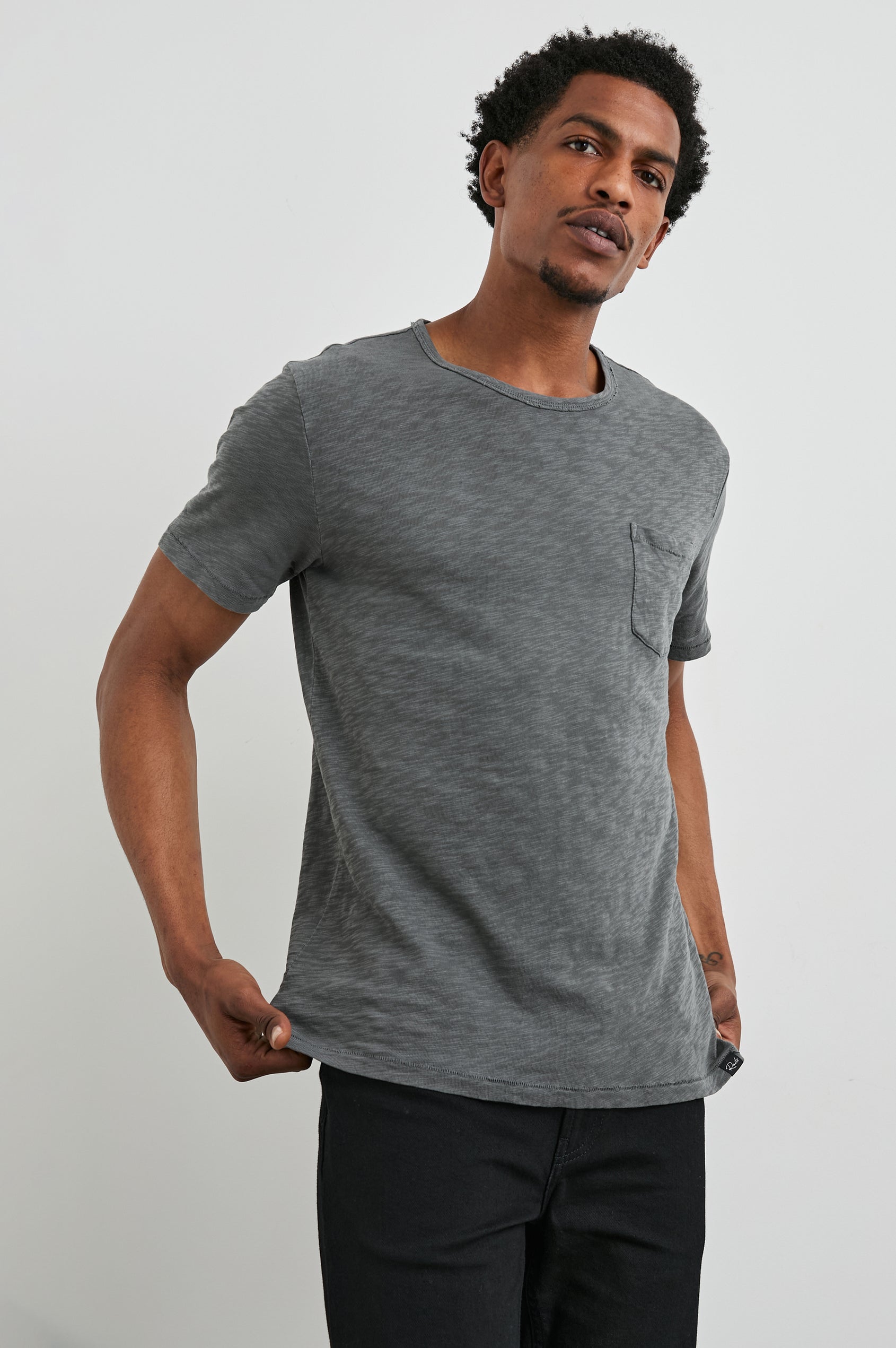 Skipper Short-Sleeve T-shirt with a Crew Neck and a Chest Patch Pocket in Washed Black Colorway - Front View Featured on Model