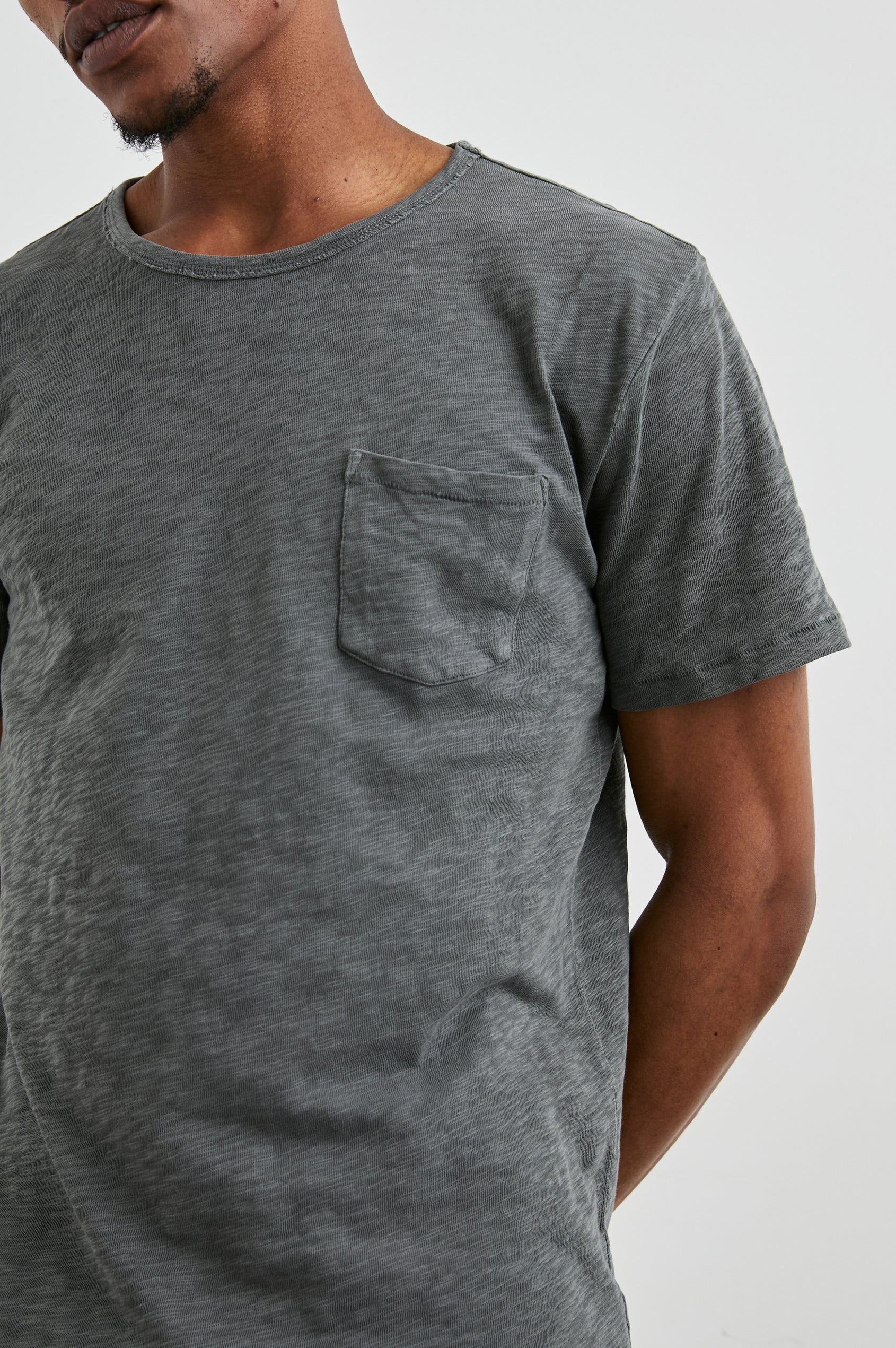 Skipper Short-Sleeve T-shirt with a Crew Neck and a Chest Patch Pocket in Washed Black Colorway - Front View Featured on Model