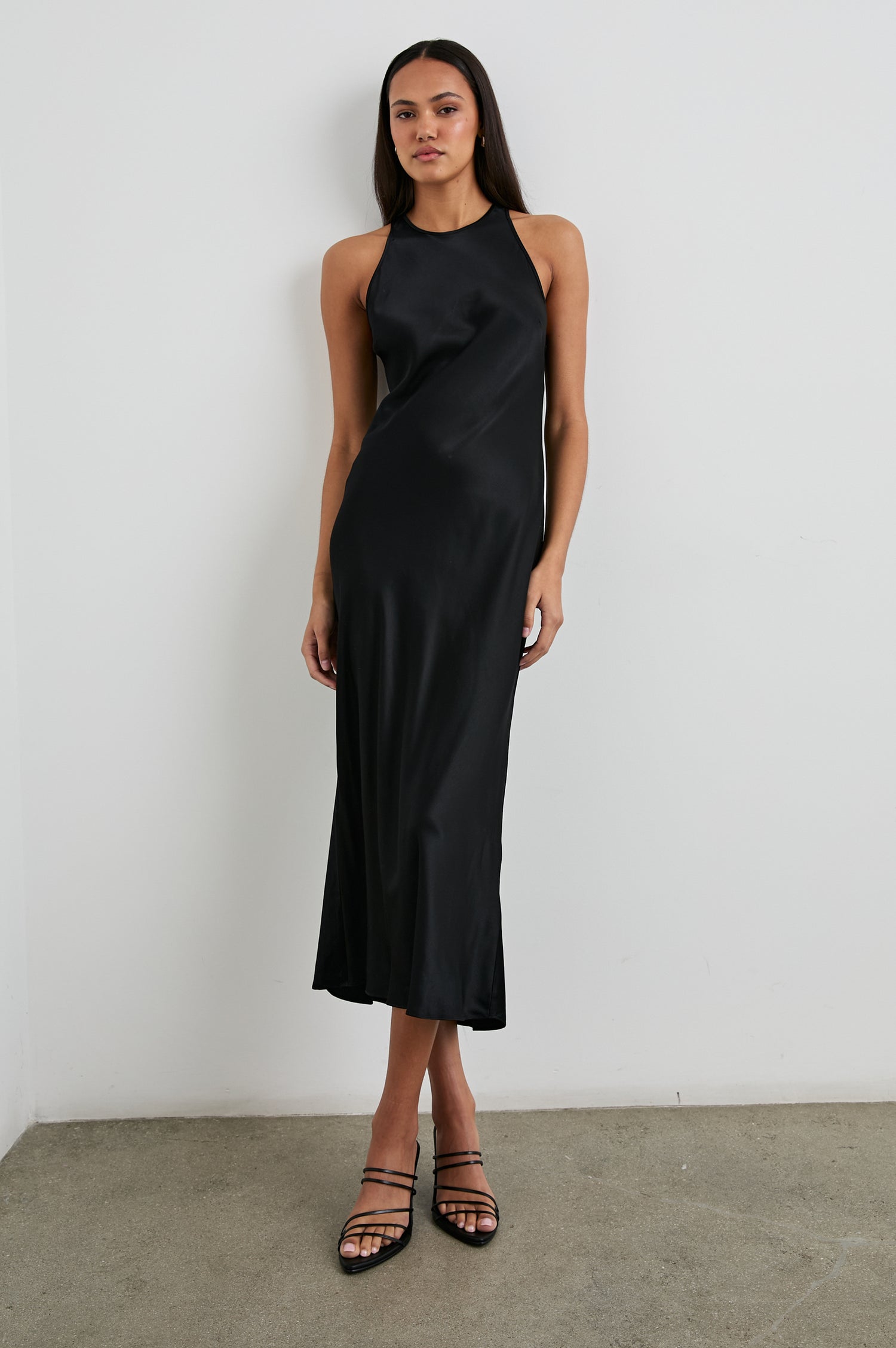 Solene Sleeveless Midi Dress with a Crew Neck and a Tie Keyhole at the Back in Black Colorway - Front Full Body View Featured on Model