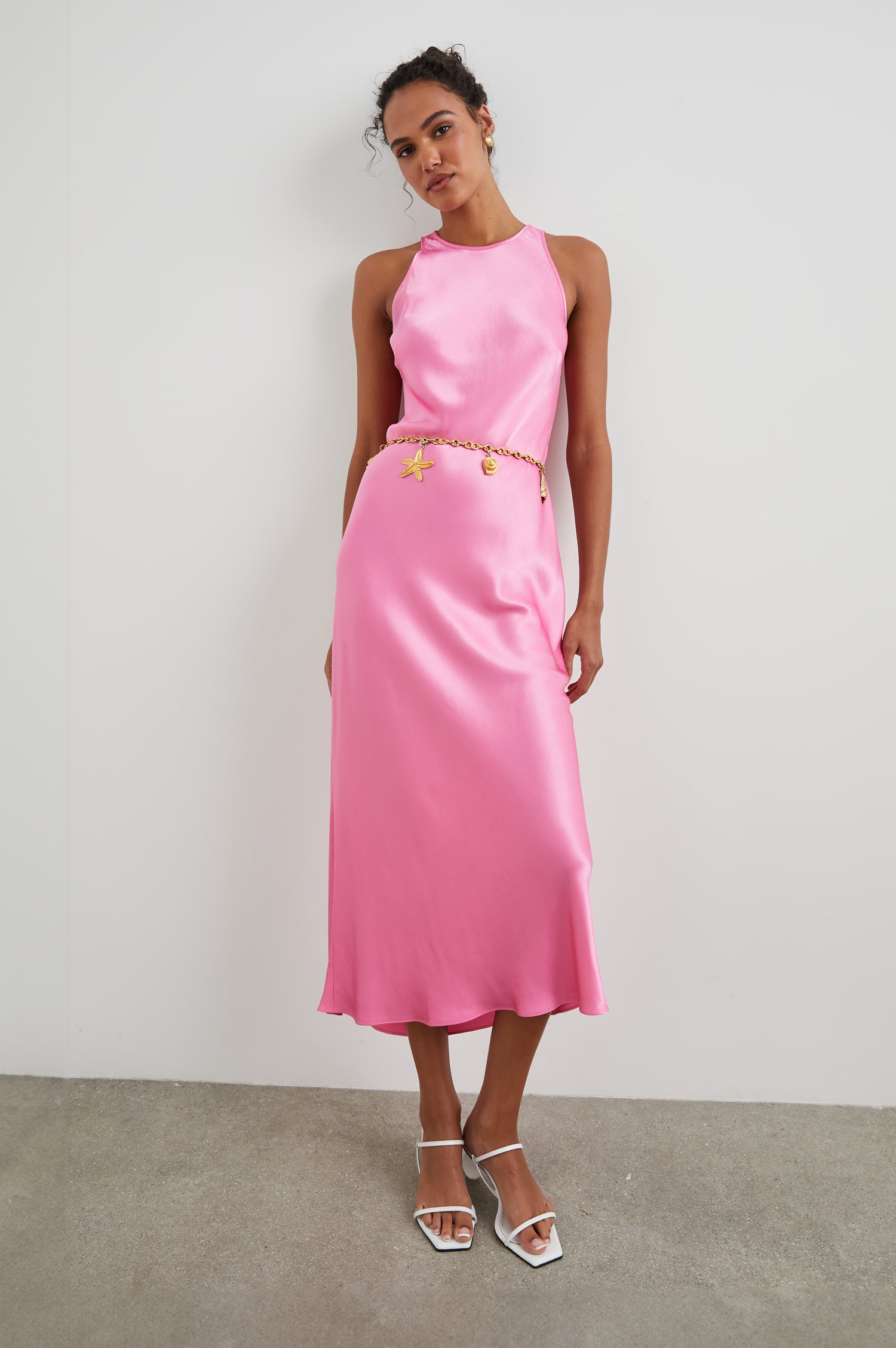 Solene Sleeveless Midi Dress with a Crew Neck and a Tie Keyhole at the Back in Malibu Pink Colorway - Front Full Body View Featured on Model
