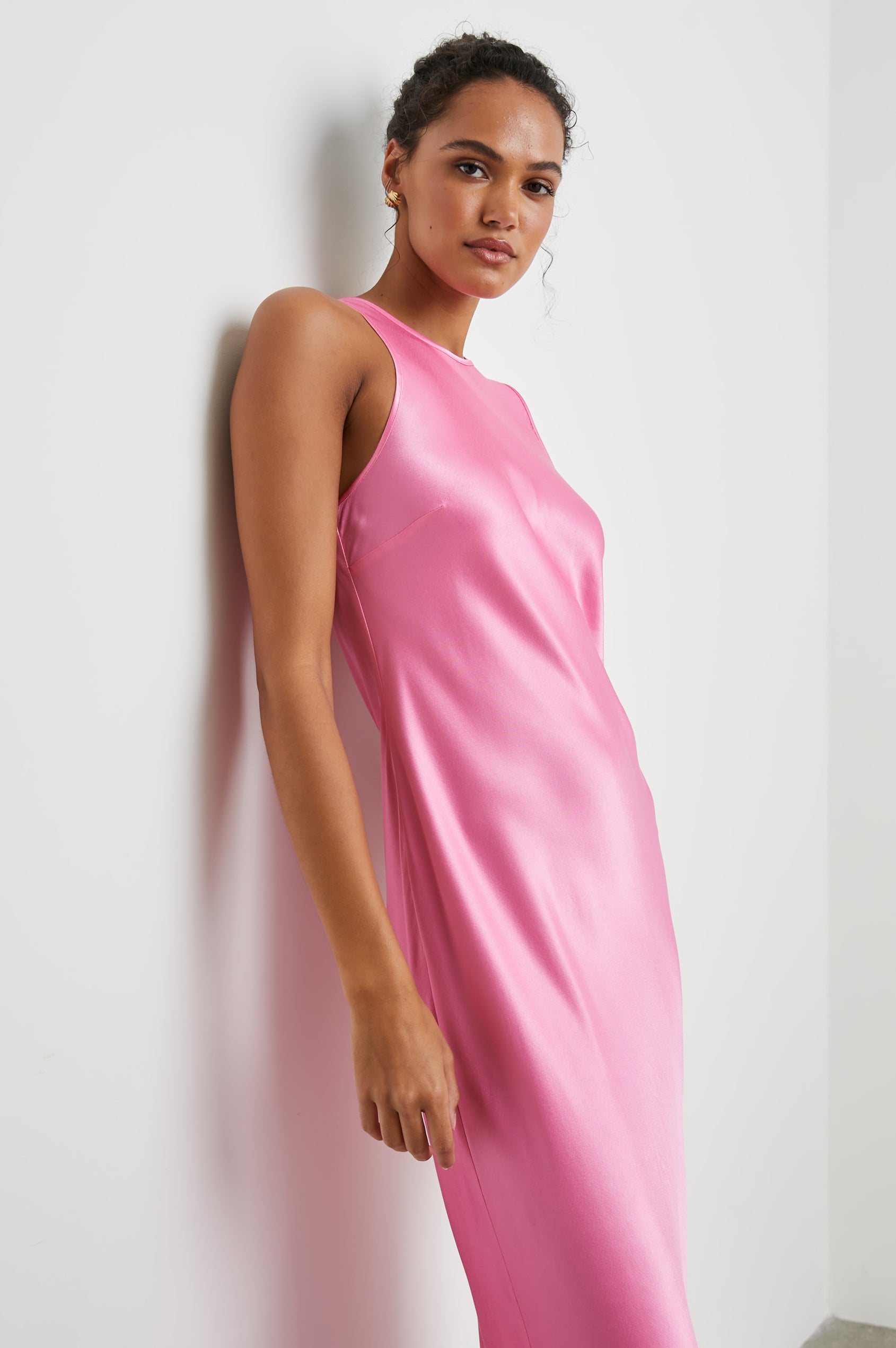 Solene Sleeveless Midi Dress with a Crew Neck and a Tie Keyhole at the Back in Malibu Pink Colorway - Side Full Body View Featured on Model