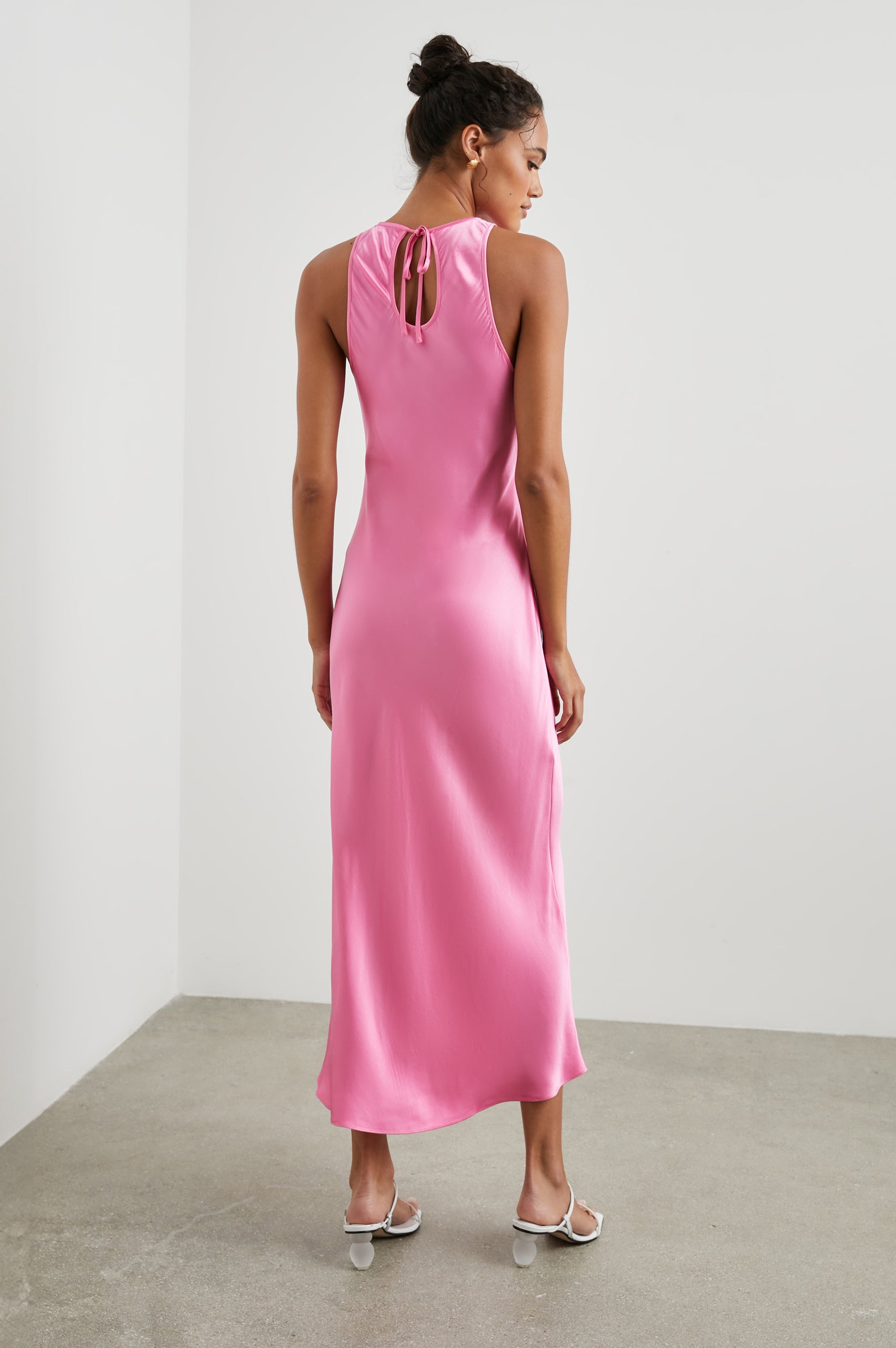 Solene Sleeveless Midi Dress with a Crew Neck and a Tie Keyhole at the Back in Malibu Pink Colorway - Back Full Body View Featured on Model