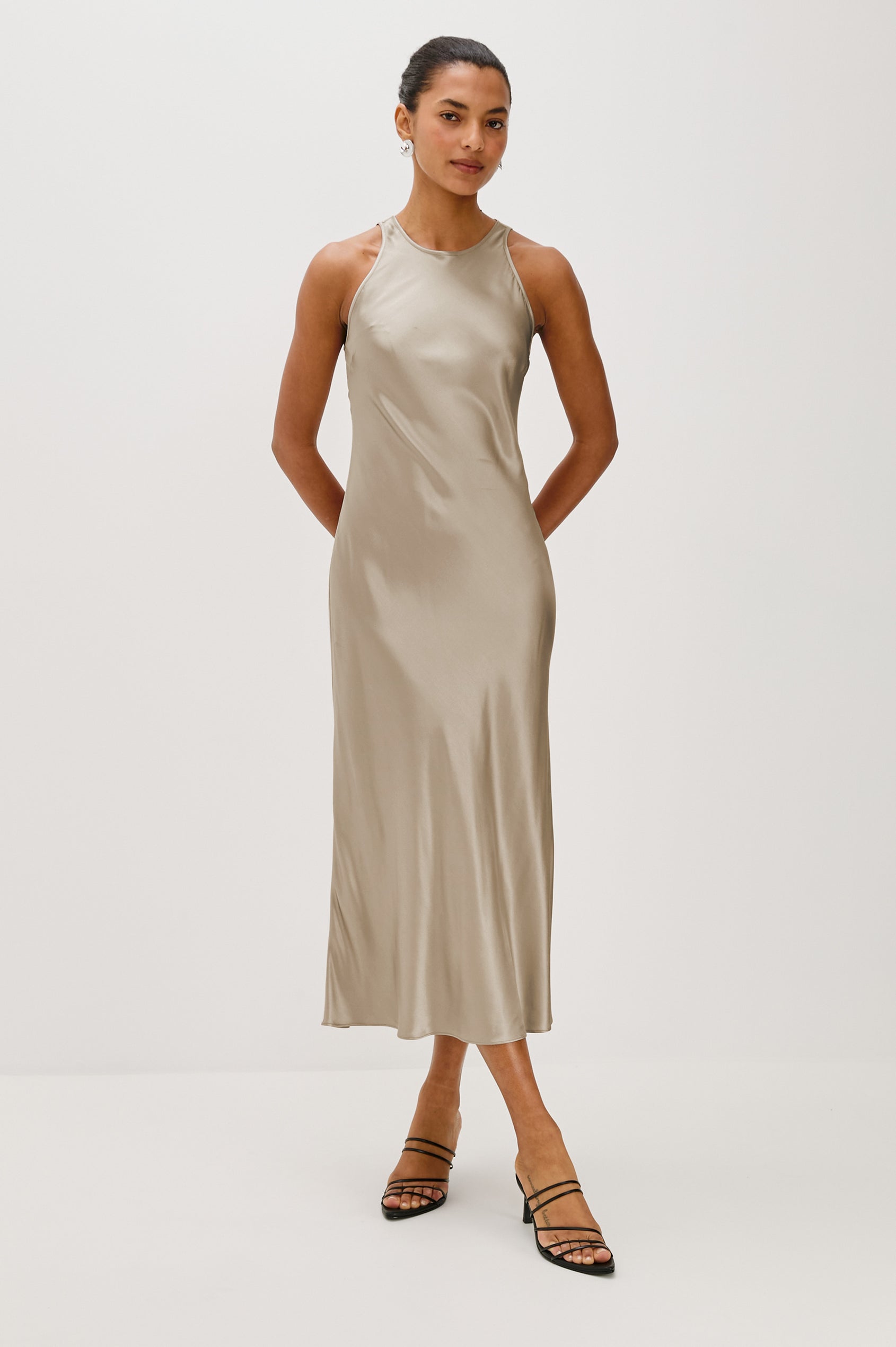 Solene Sleeveless Midi Dress with a Crew Neck and a Tie Keyhole at the Back in Mink Colorway - Front Full Body View Featured on Model