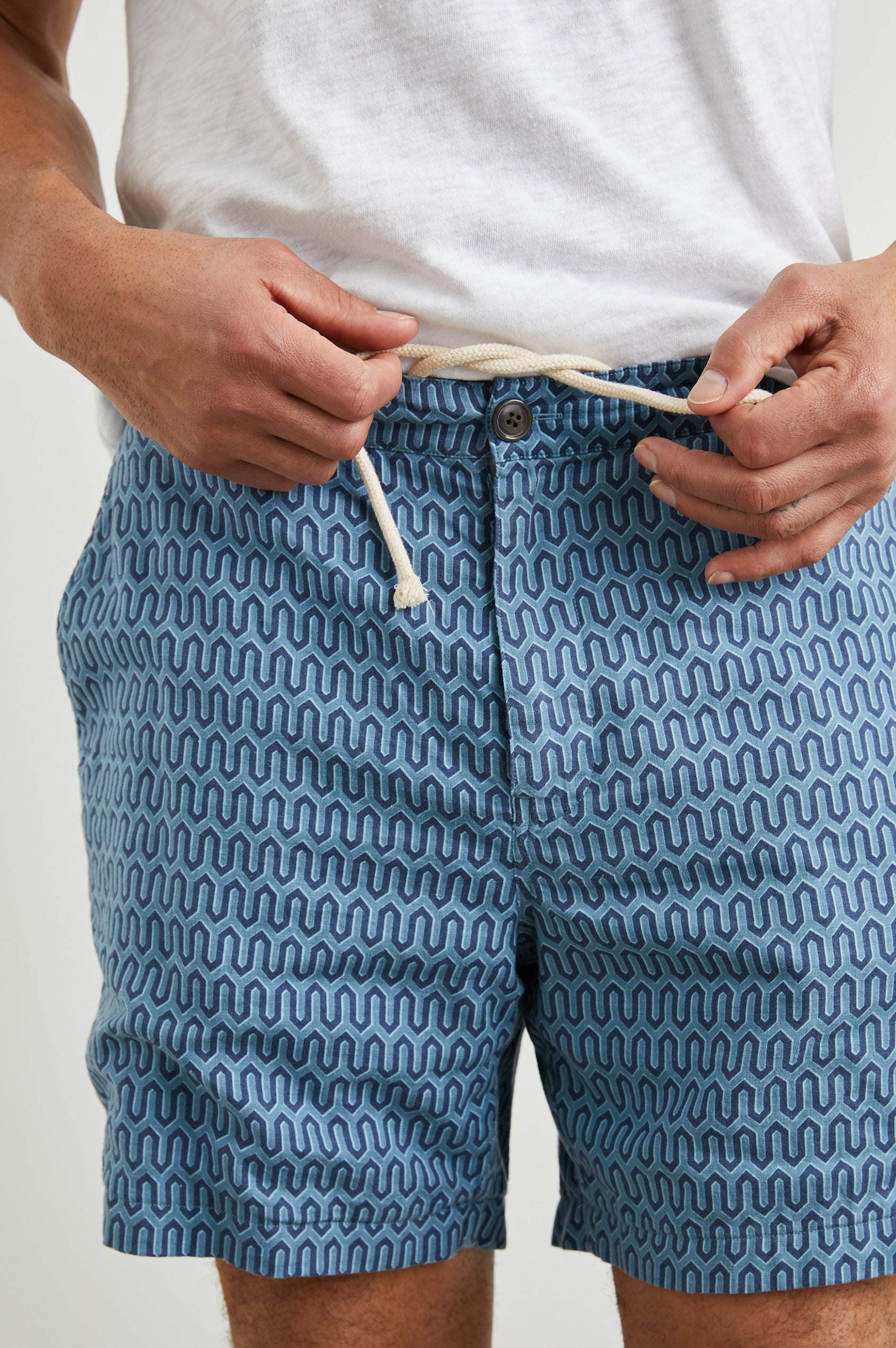 Sona Shorts with Two Front Pockets and Two Back Button Welt Pockets in Wishbone Blues Colorway, a Geometric pattern in Blue on Blues - Front View Featured on Model 
