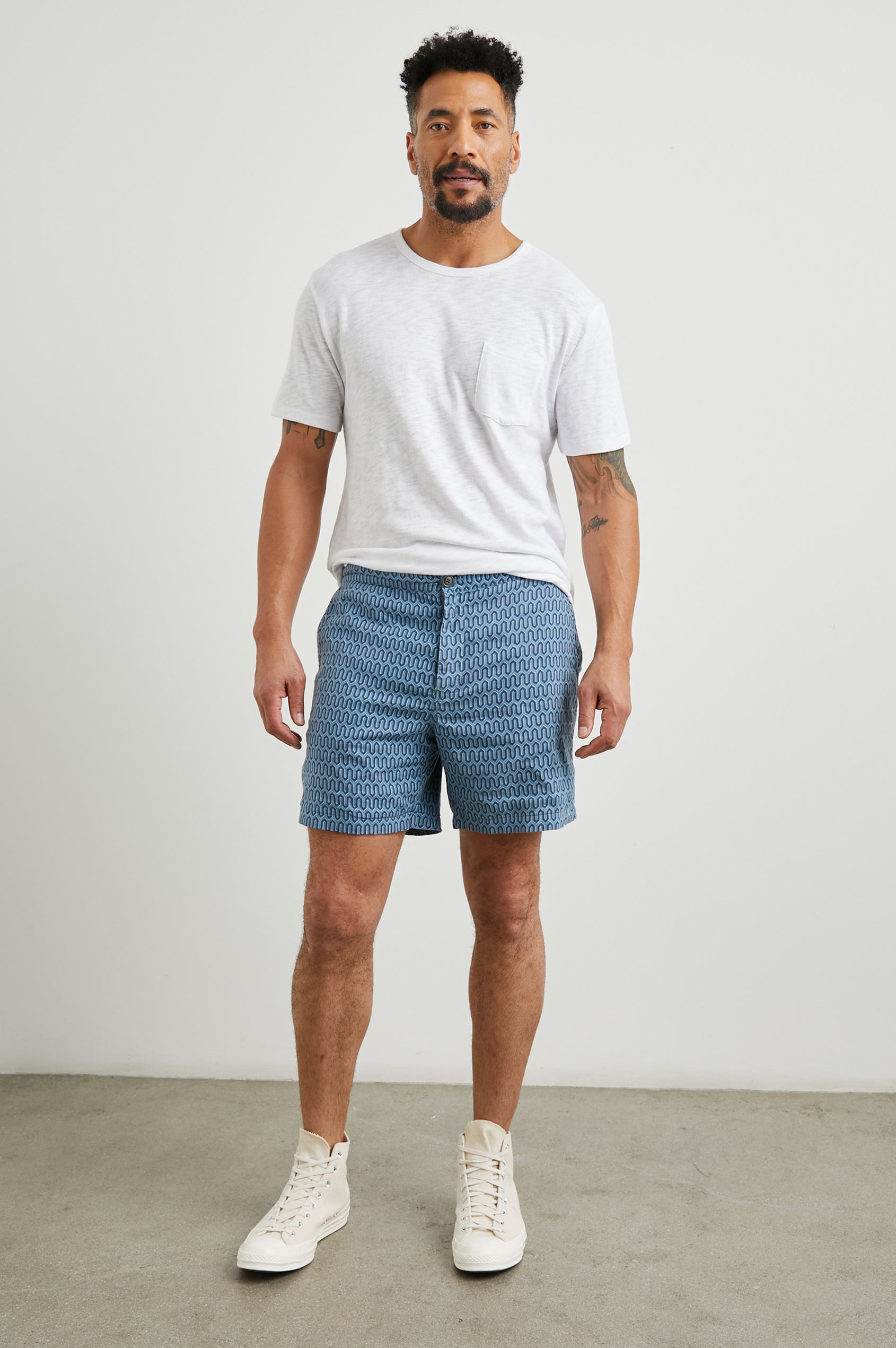 Sona Shorts with Two Front Pockets and Two Back Button Welt Pockets in Wishbone Blues Colorway, a Geometric pattern in Blue on Blues - Front Full Body View Featured on Model 
