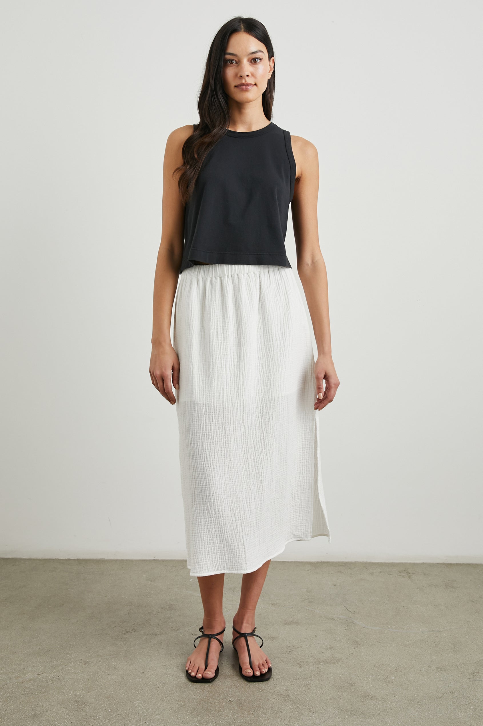 Soraya Midi Skirt with a Side Slit and Lined to the Mid-Thigh in White Colorway - Front Full Body View Featured on Model 