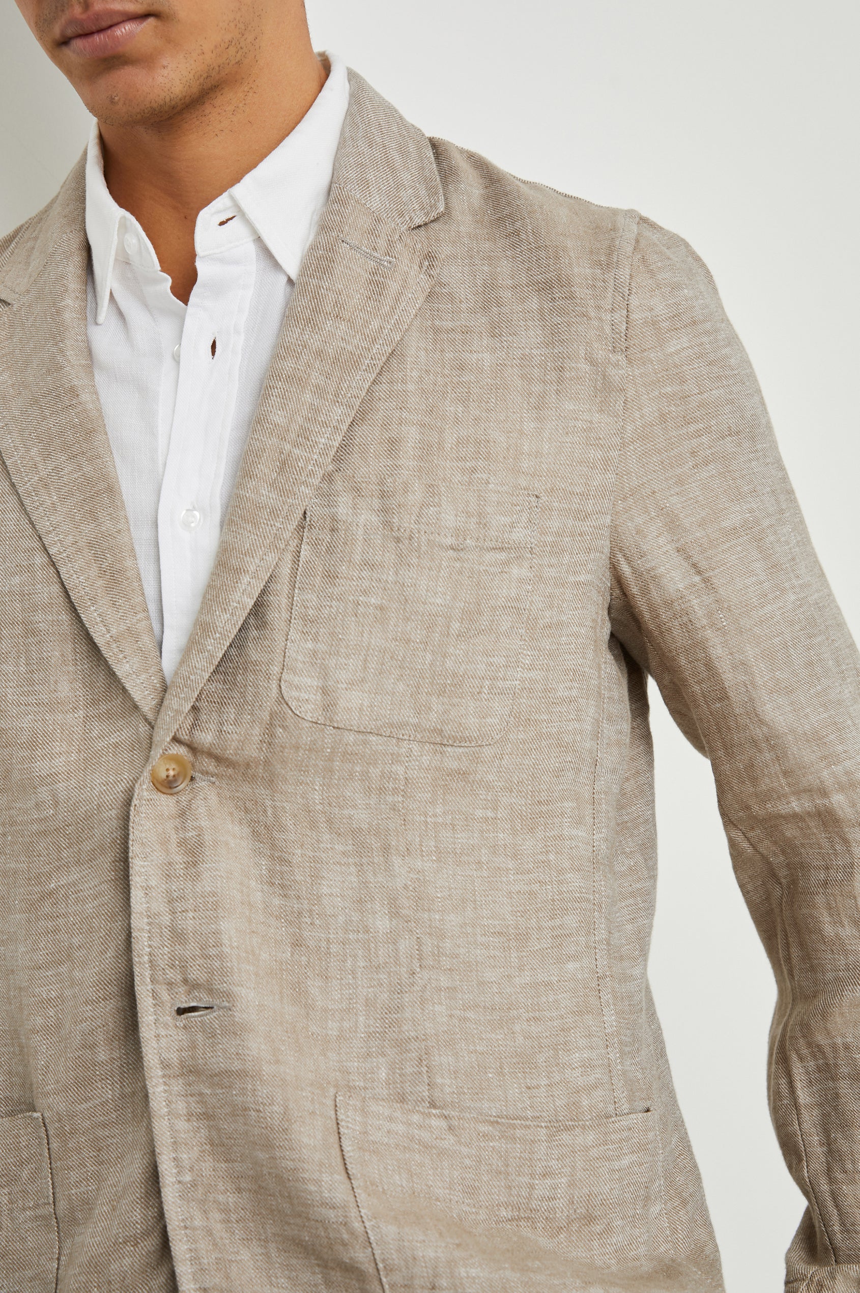 Sorrento Blazer with Two Button Closure, Two Front Flap Pockets, a Chest Patch Pocket and Three-Button Cuffs in Bulgur Colorway - Front View Featured on Model