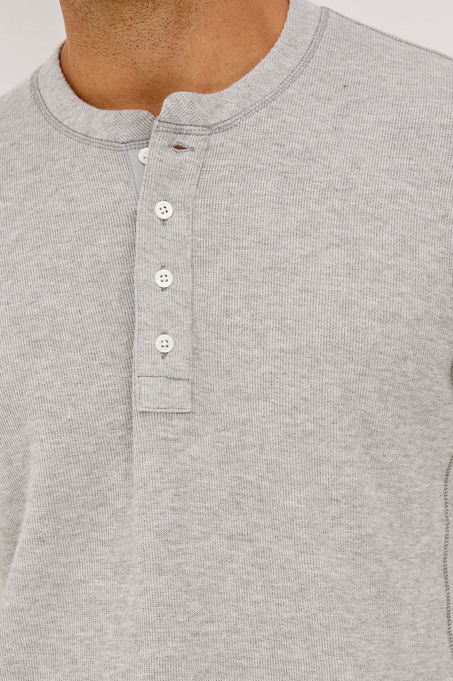 Soto Henley in Rib Cotton With Half Button Placket, Long Sleeves, and Crew Neckline in Grey Heather Colorway - Upper Body Front View Featured on Model