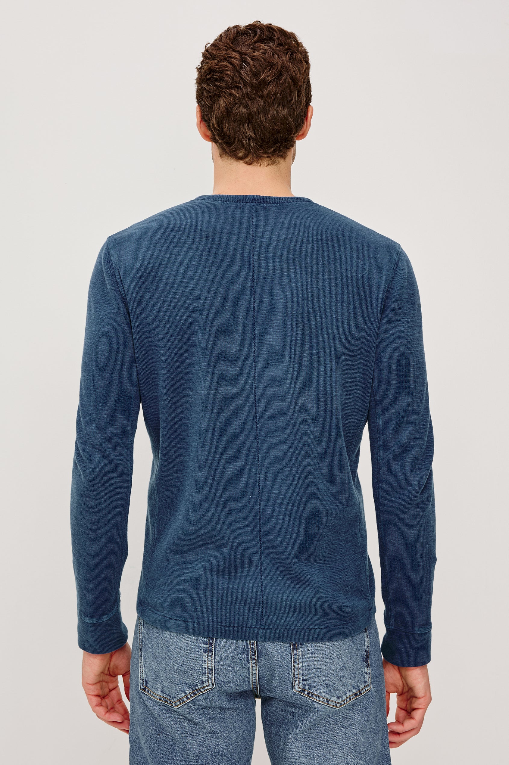 Soto Long-Sleeve Henley with a Four Button Placket and a Crew Neck in Vintage Indigo Colorway - Back View Featured on Model