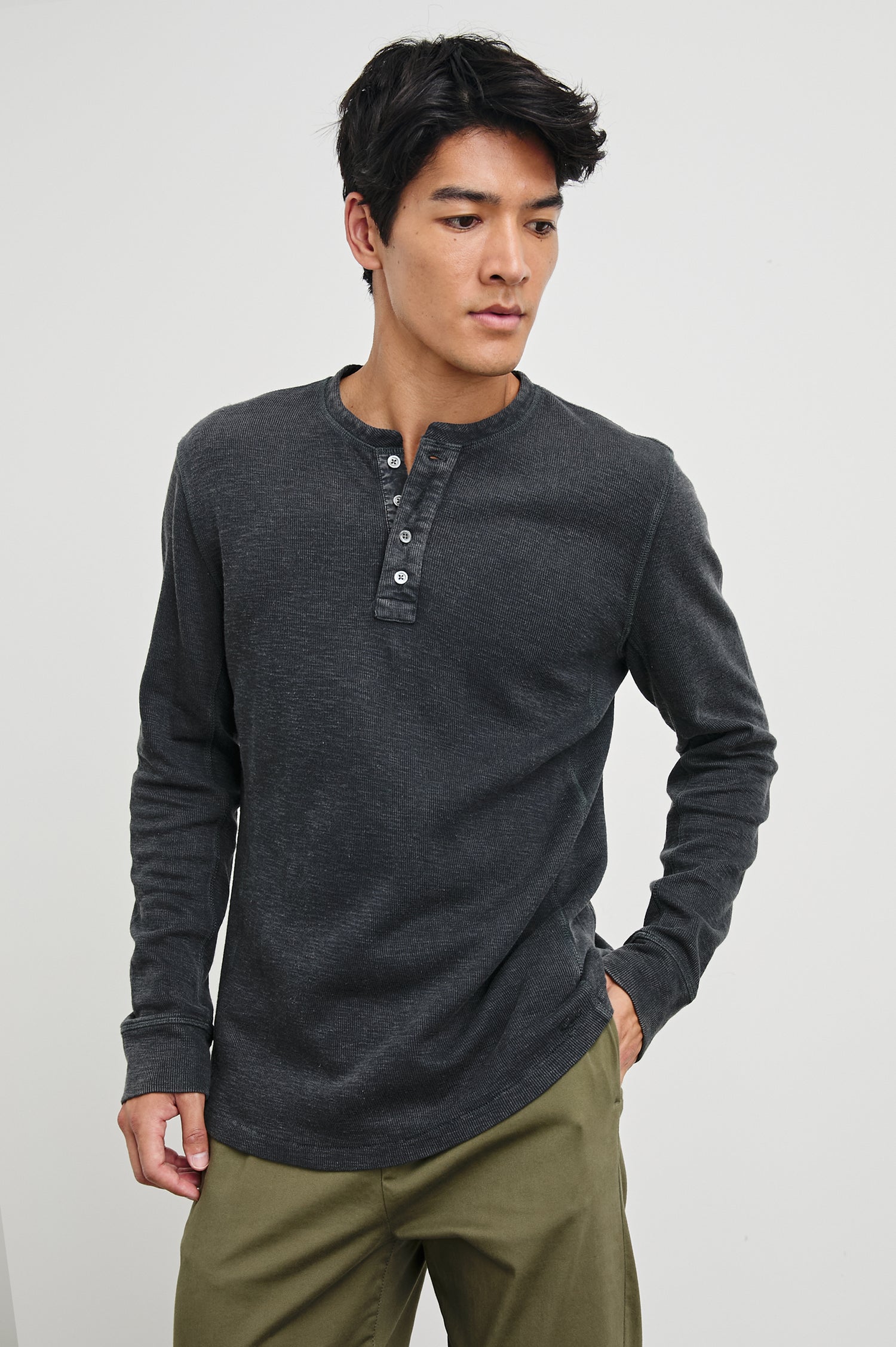 Soto Long-Sleeve Henley with a Four Button Placket and a Crew Neck in Washed Black Colorway - Front View Featured on Model