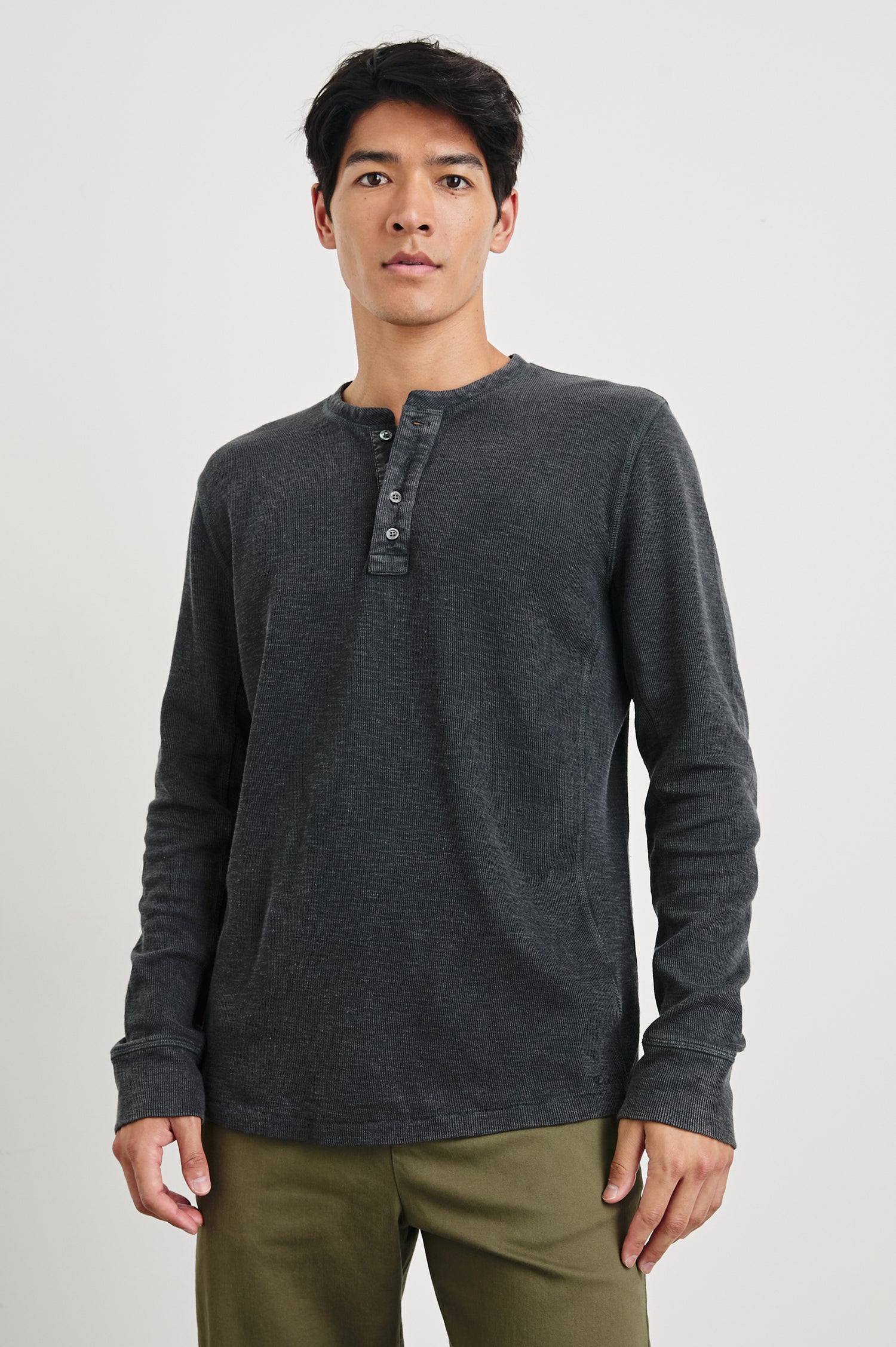 Soto Long-Sleeve Henley with a Four Button Placket and a Crew Neck in Washed Black Colorway - Front View Featured on Model