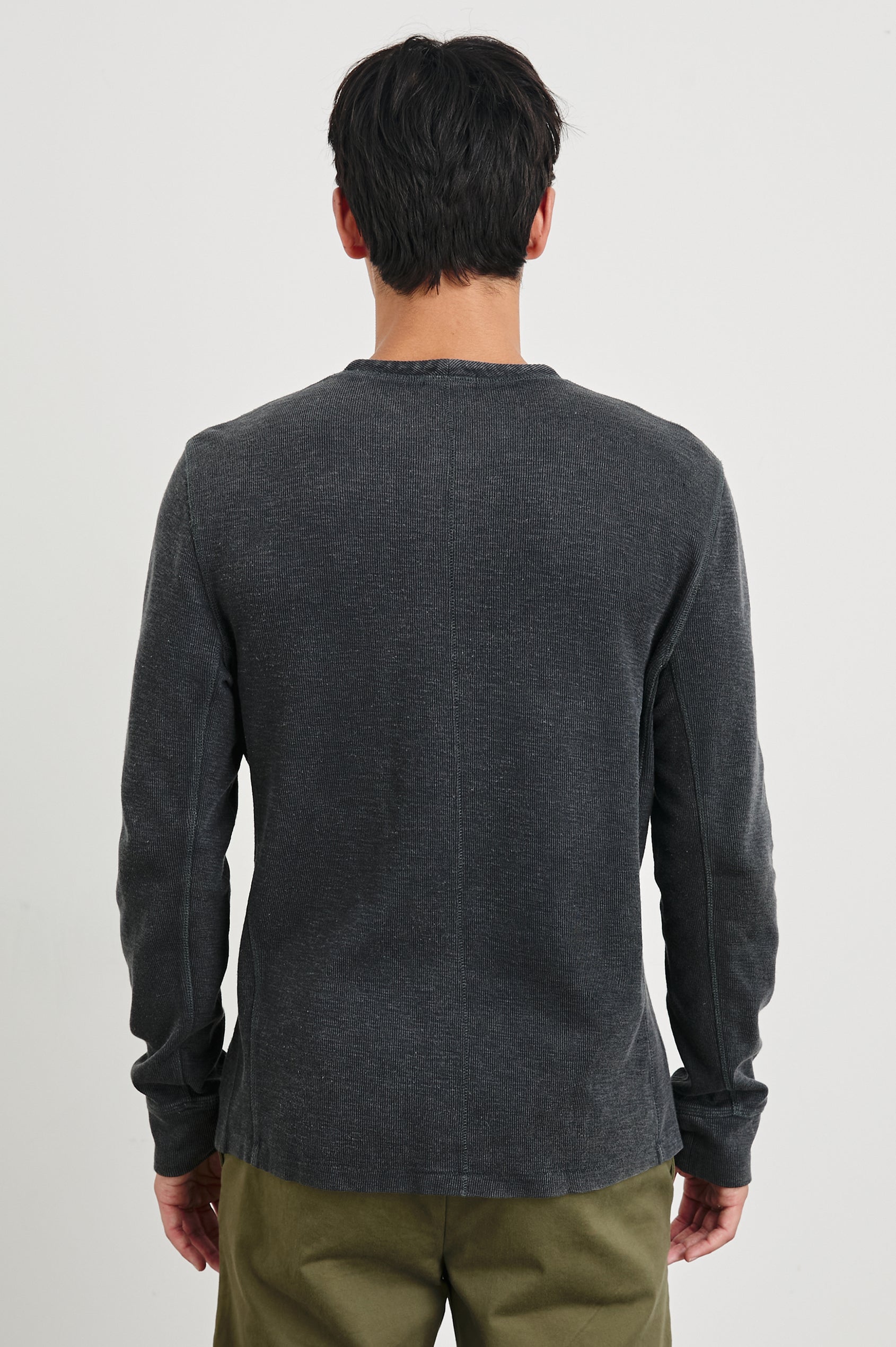 Soto Long-Sleeve Henley with a Four Button Placket and a Crew Neck in Washed Black Colorway - Back View Featured on Model