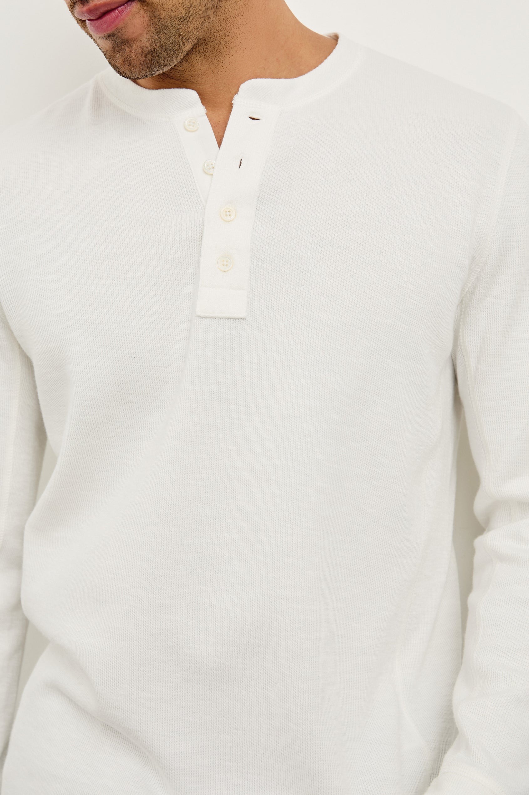 Soto long sleeve henley with front button half placket in Whitecap - close up of details on model