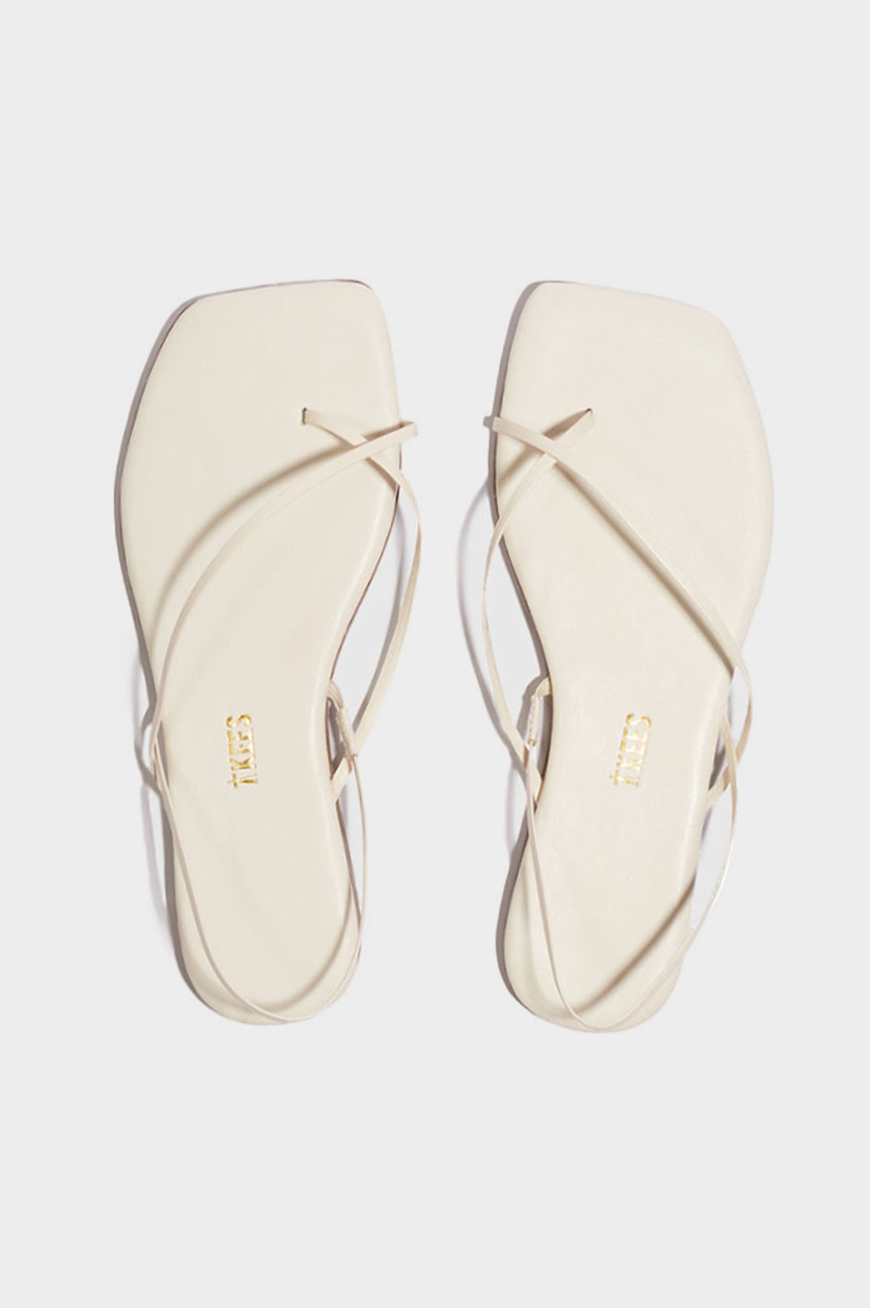 Millie Square toe leather sandal with thin straps wrapping the ankle and front in Cream white - pair of shoes shot from above angle