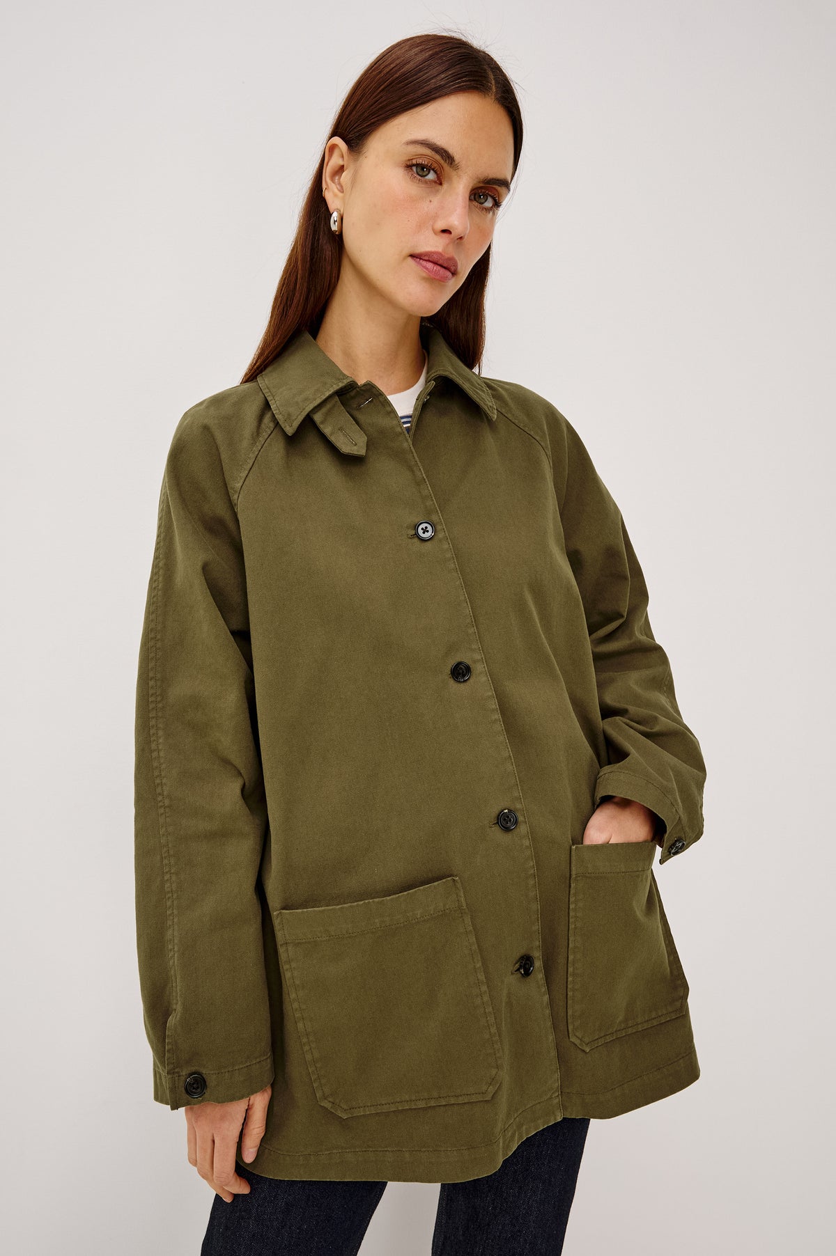 Stafford Jacket in Cotton Canvas With Relaxed Fit, Open Collar With Buttons for Funnel Neckline, Dual Patch Pockets, and Long Sleeves in Olive Colorway - Upper Body Front View Featured on Model