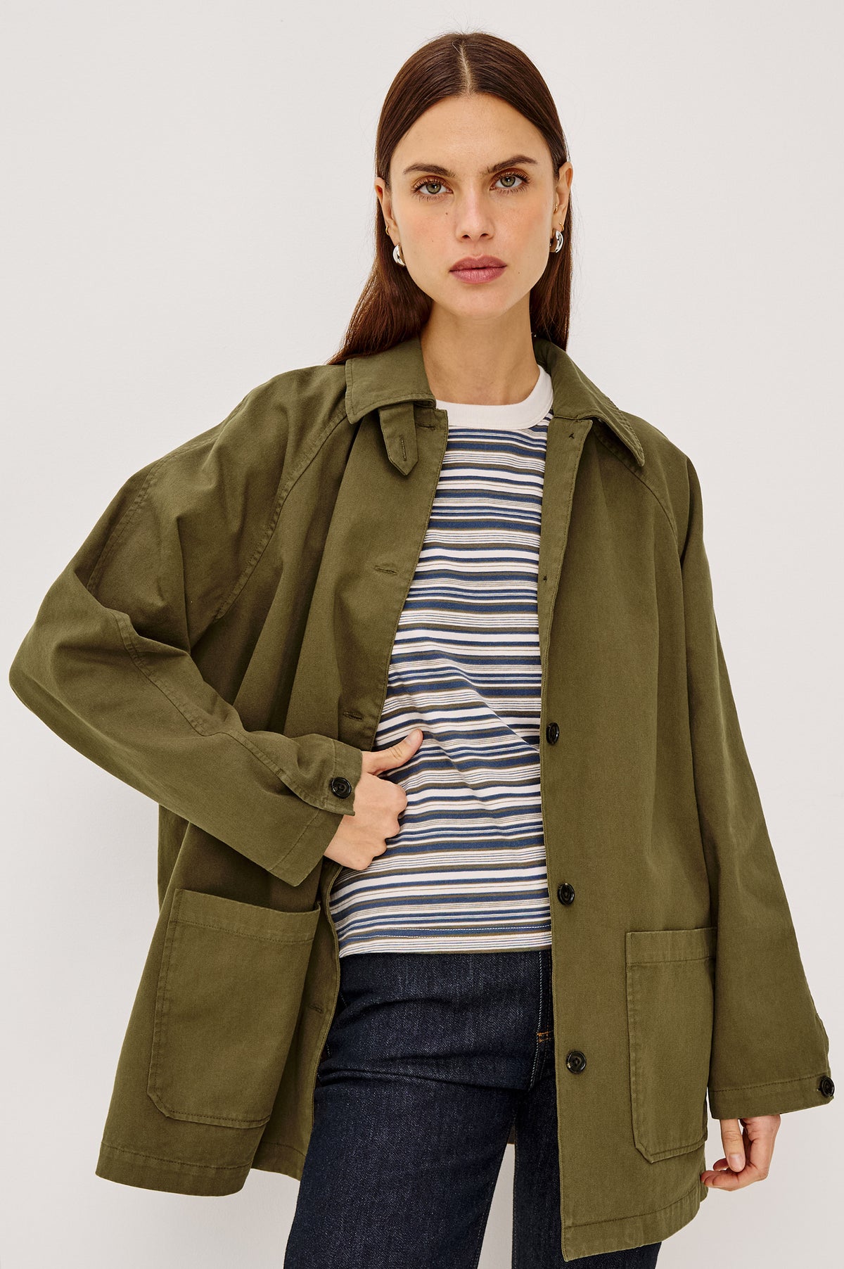 Stafford Jacket in Cotton Canvas With Relaxed Fit, Open Collar With Buttons for Funnel Neckline, Dual Patch Pockets, and Long Sleeves in Olive Colorway - Upper Body Front View Featured on Model