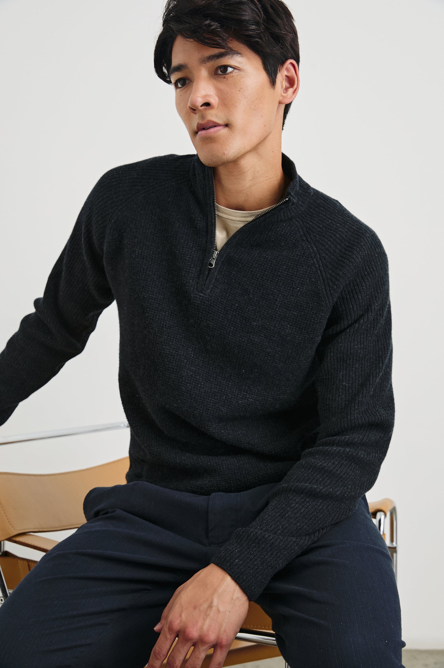 Stark Long-Sleeve Quarter Zip with a Mock Neck, Waffle Torso, and Ribbed Sleeves in Cast Iron Colorway - Front View Featured on Seated Model