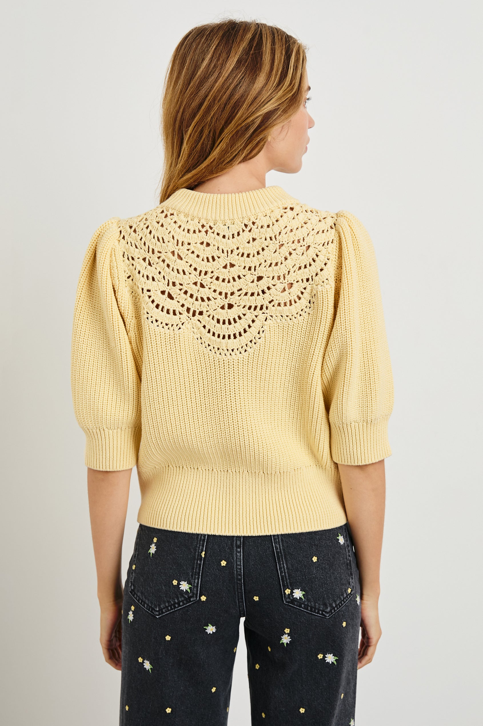 Steph Sweater with Elbow Length Sleeves, Ribbed Trims, a Crew Neck and Crochet on the Upper Chest in Meringue Colorway - Back View Featured on Model