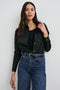 Stina Long-Sleeve Button Up with a Chest Patch Pocket in Black Colorway - Front Tucked View Featured on Model