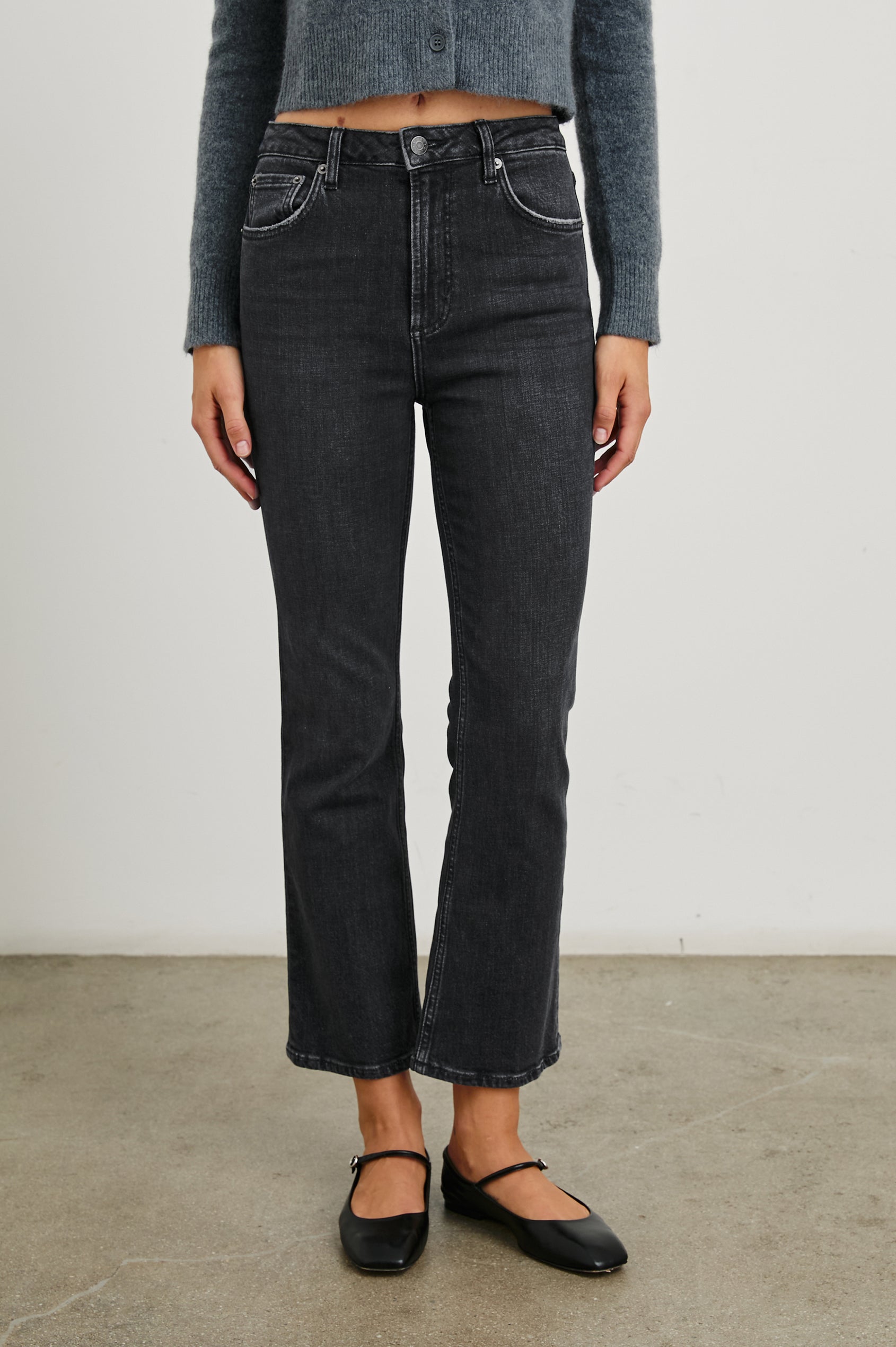 Sunset Crop Slim Fare Jeans with Belt Loops, Two Front Pockets plus a Coin Pocket and Two Back Patch Pockets in Black Pearl Colorway - Front View Featured on Model