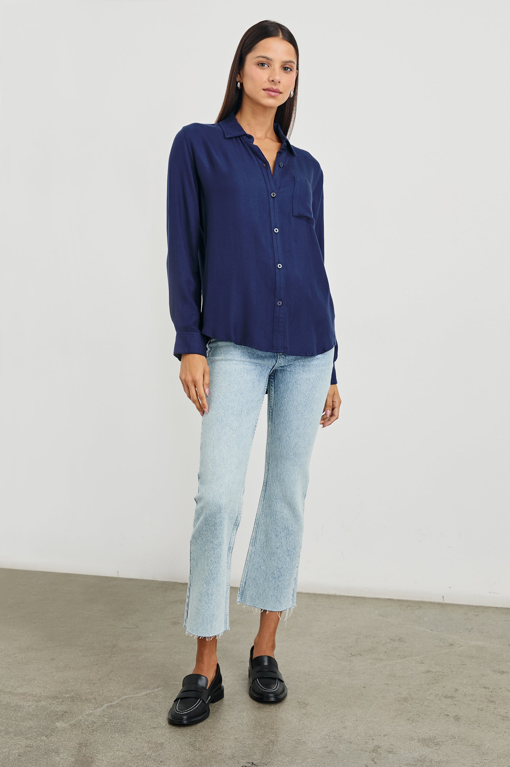 Sunset Crop Slim Fare Jeans with a Raw Hem, Belt Loops, Two Front Pockets plus a Coin Pocket and Two Back Patch Pockets in Snowbird Colorway - Front Full Body View Featured on Model