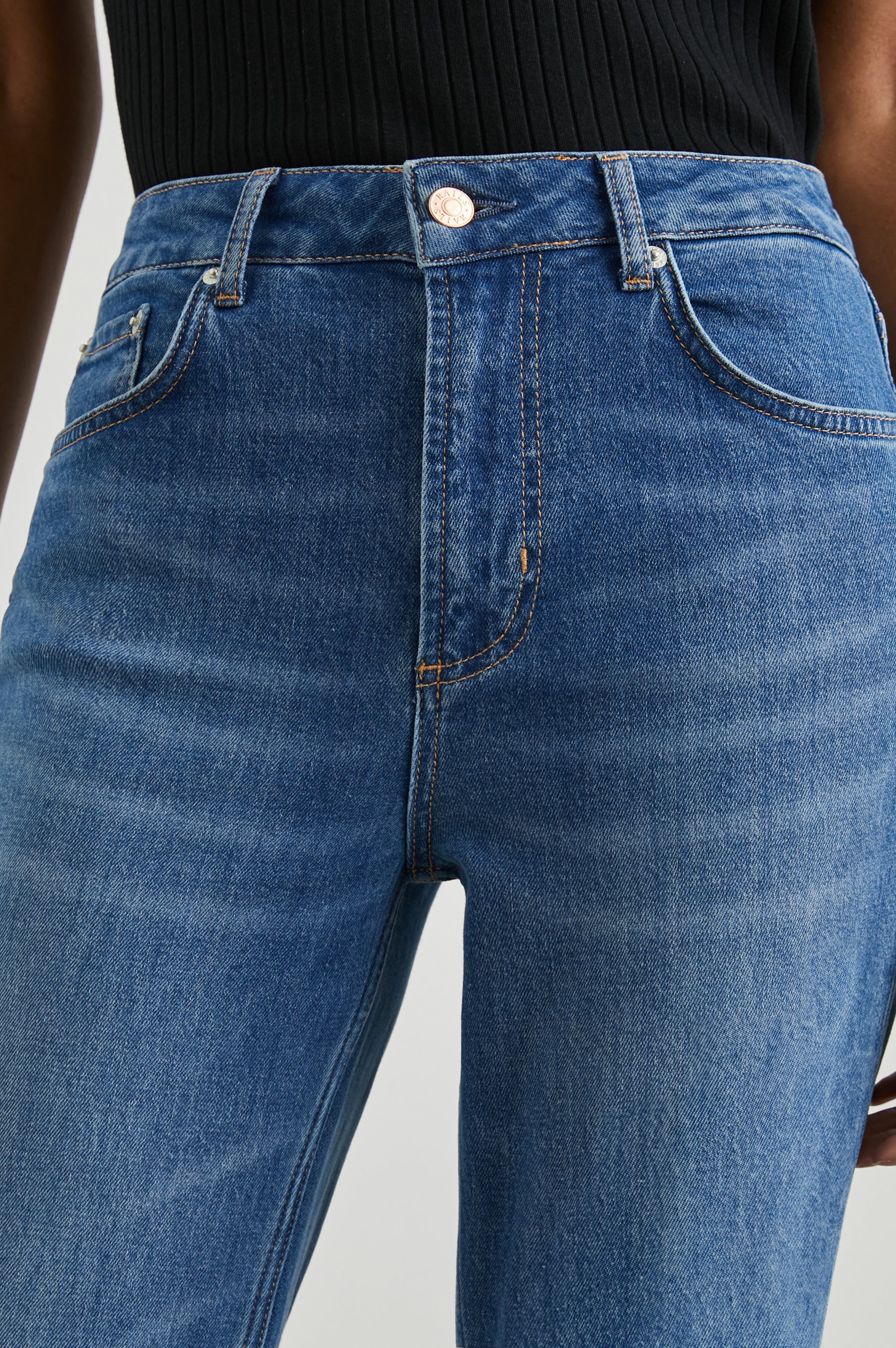 Sunset Crop Slim Fare Jeans with Belt Loops, Two Front Pockets plus a Coin Pocket and Two Back Patch Pockets in Tidal Wave Colorway - Front View Featured on Model