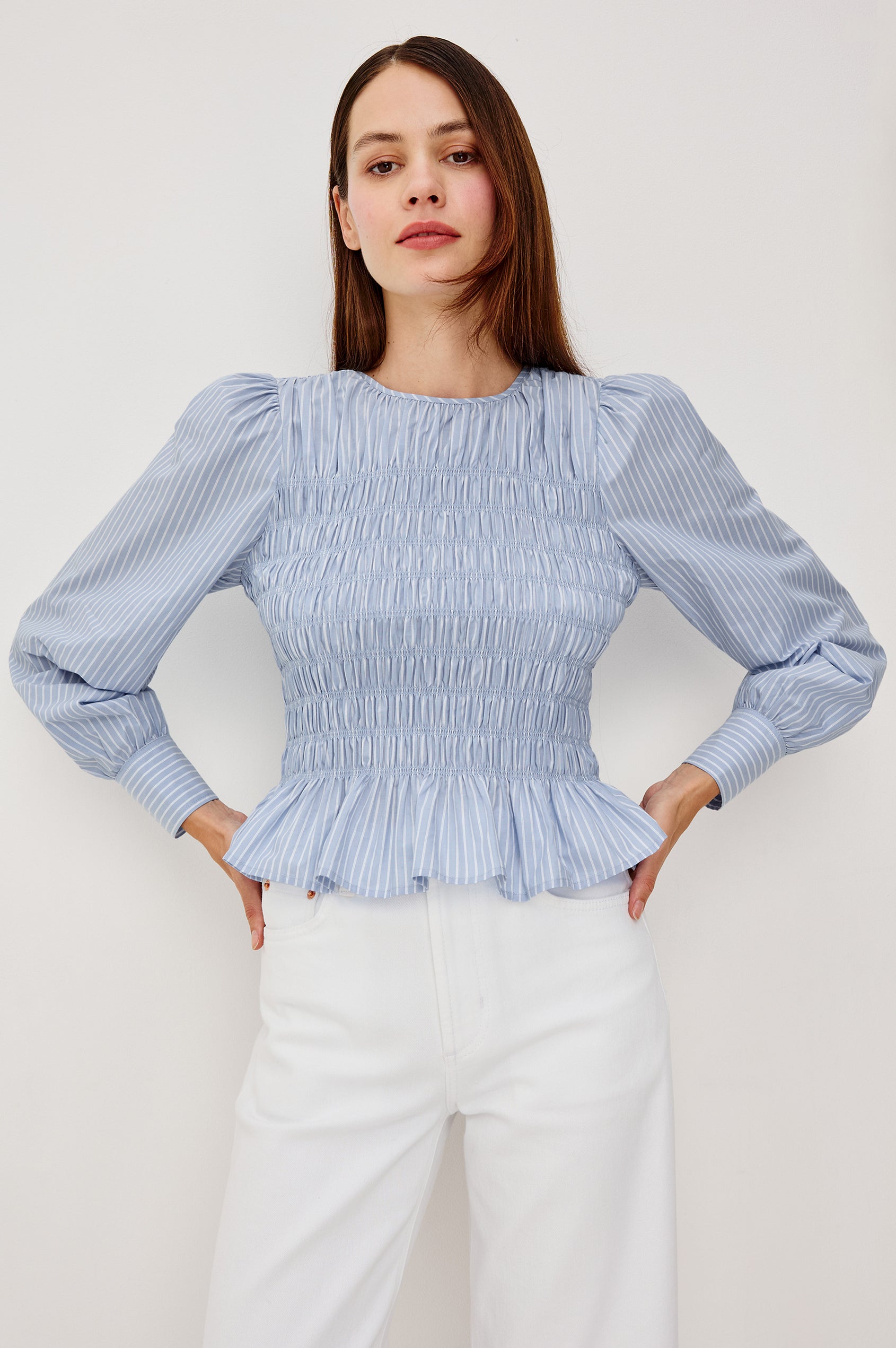 Tabi Blouse Top in Poplin With Smocked Body, Long Puff Sleeves With Fitted Cuffs, Contrast Embroidered Detailing, and Back Keyhole Cutout in White Stripe Colorway - Upper Body Front View Featured on Model