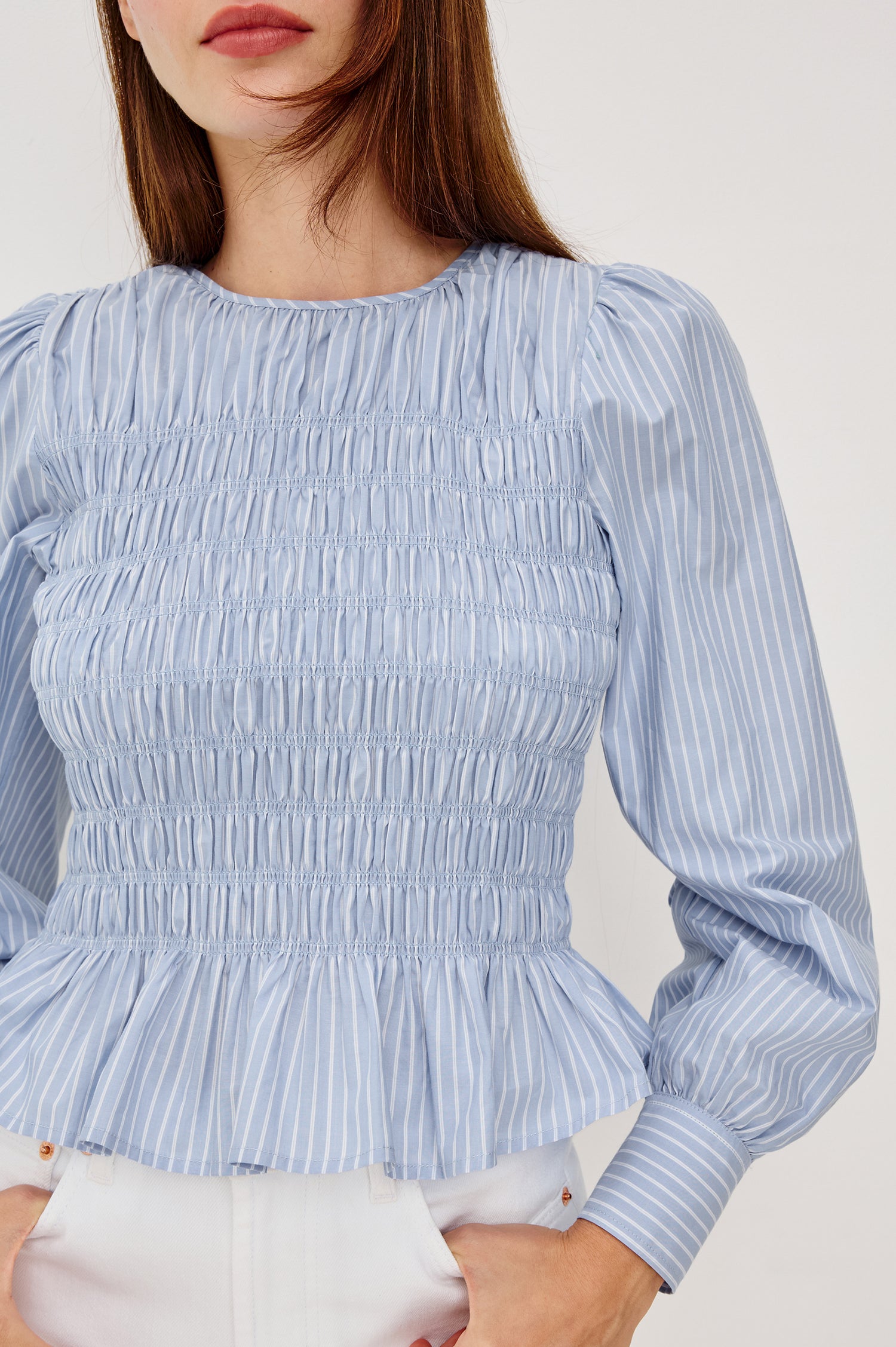 Tabi Blouse Top in Poplin With Smocked Body Long Puff Sleeves With Fitted Cuffs Contrast Embroidered Detailing and Back Keyhole Cutout in White Stripe Colorway - Upper Body Front View Featured on Model