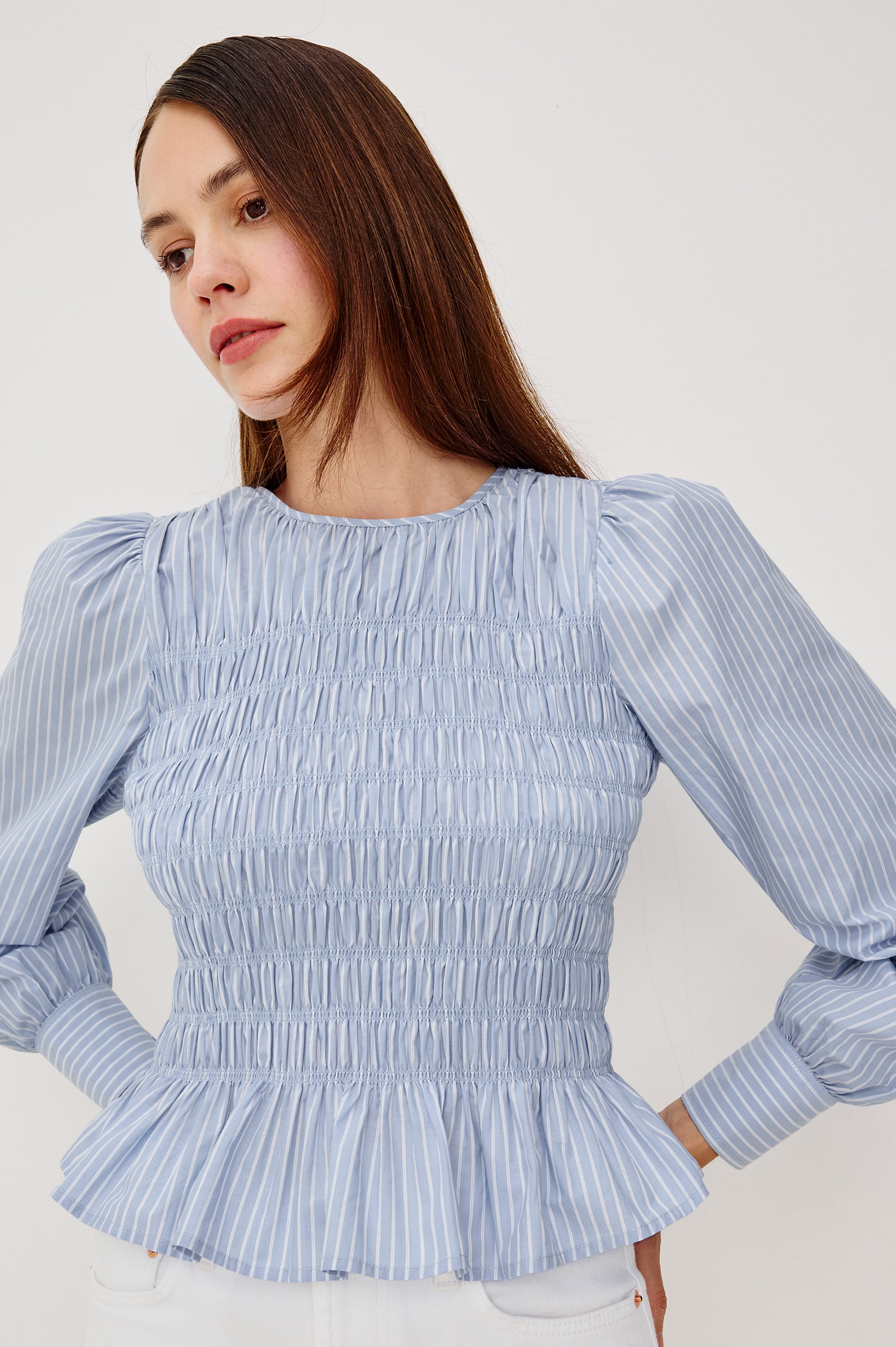 Tabi Blouse Top in Poplin With Smocked Body, Long Puff Sleeves With Fitted Cuffs, Contrast Embroidered Detailing, and Back Keyhole Cutout in White Stripe Colorway - Upper Body Front View Featured on Model