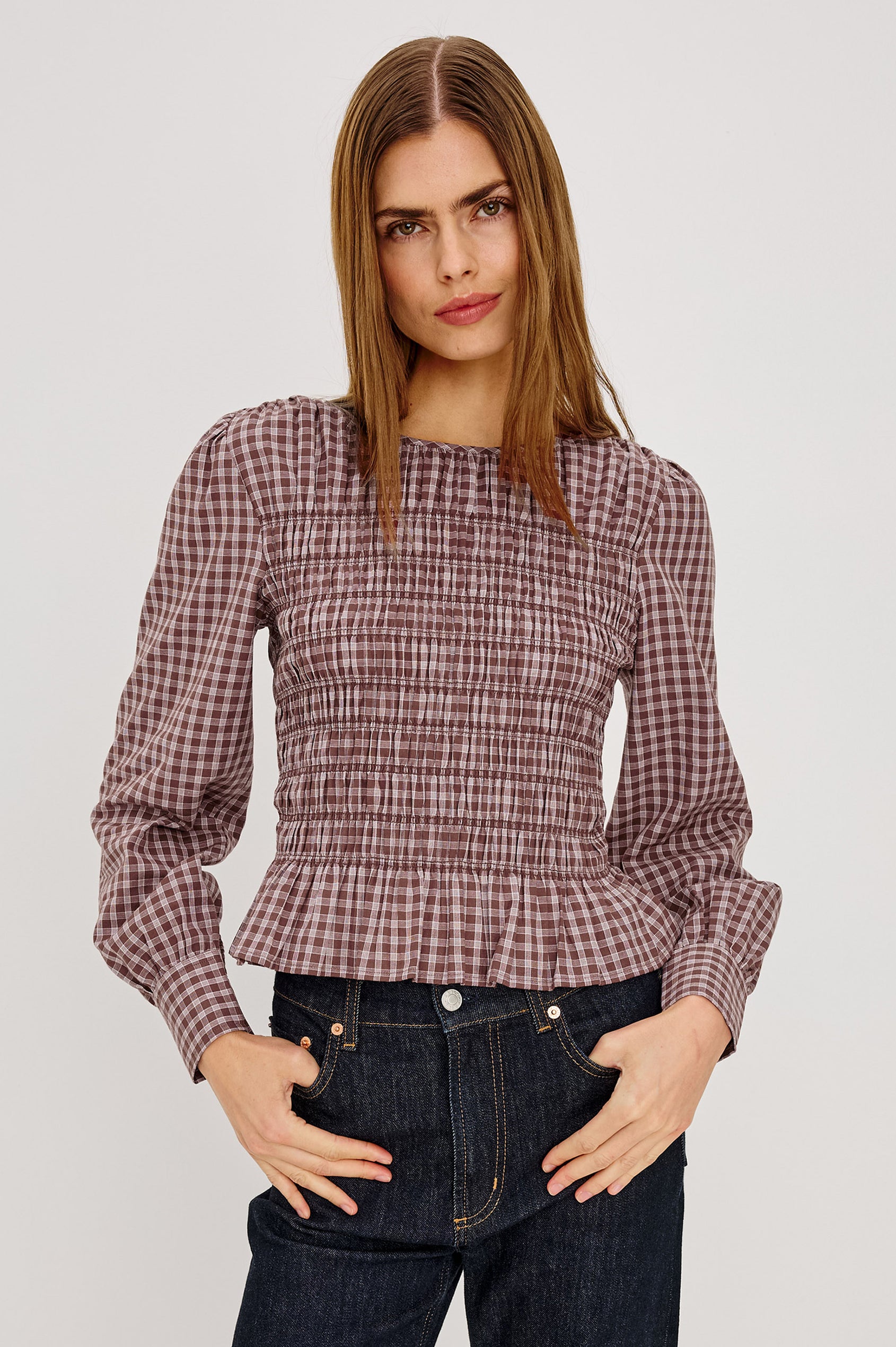 Tabi Shirt in Cotton Poplin With Fitted Smocked Bodice, Flared Peplum Hem, Long Puff Sleeves, and Shirred Neckline in Rust Rose Colorway - Upper Body Front View Featured on Model
