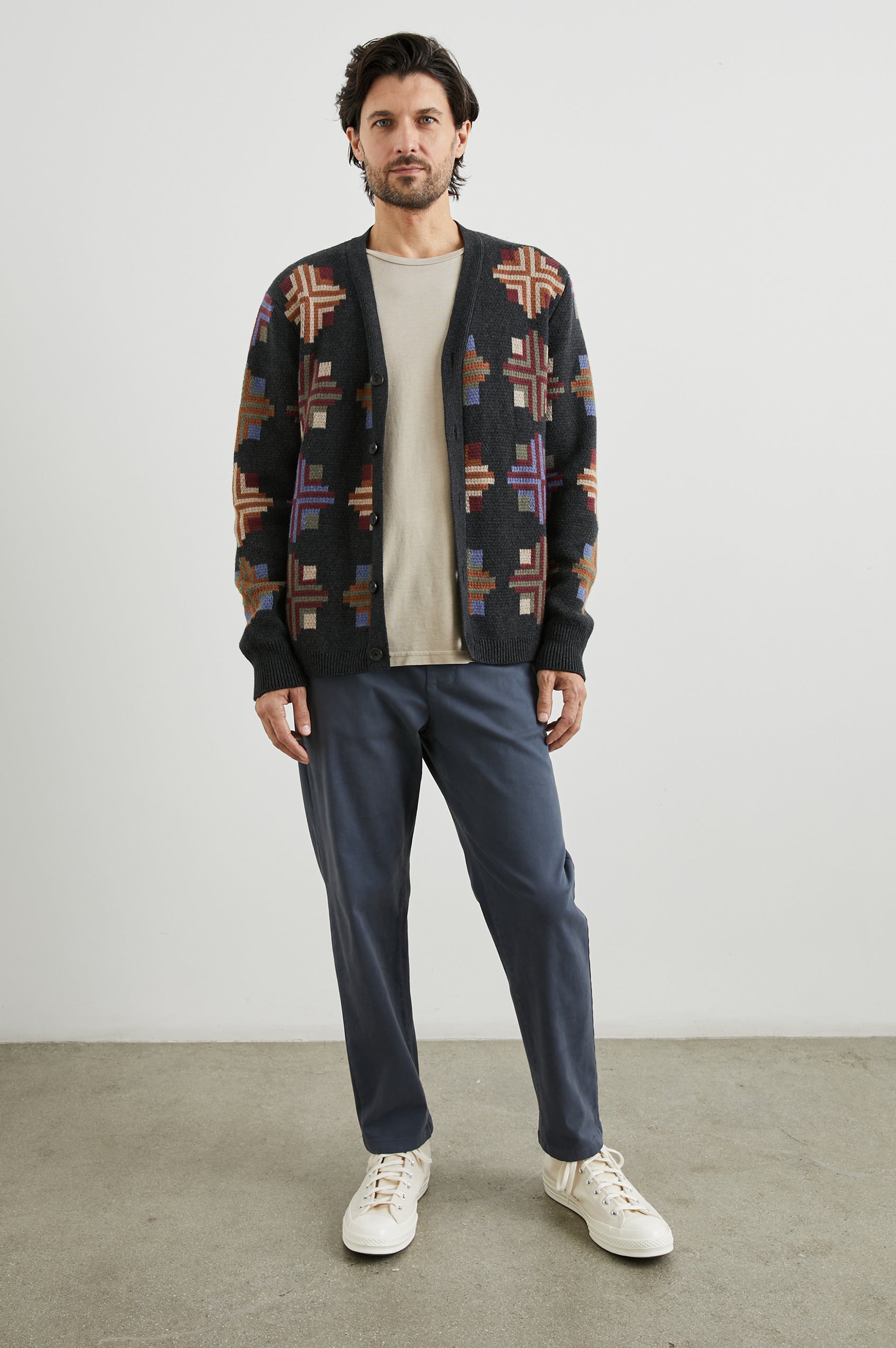 Taos Long-Sleeve Cardigan with Button Closure, V Neck and Ribbed Trim in Heirloom Patchwork Colorway, Multi-Colored Geometric Designs on Dark Grey - Front Full Body View Featured on Model