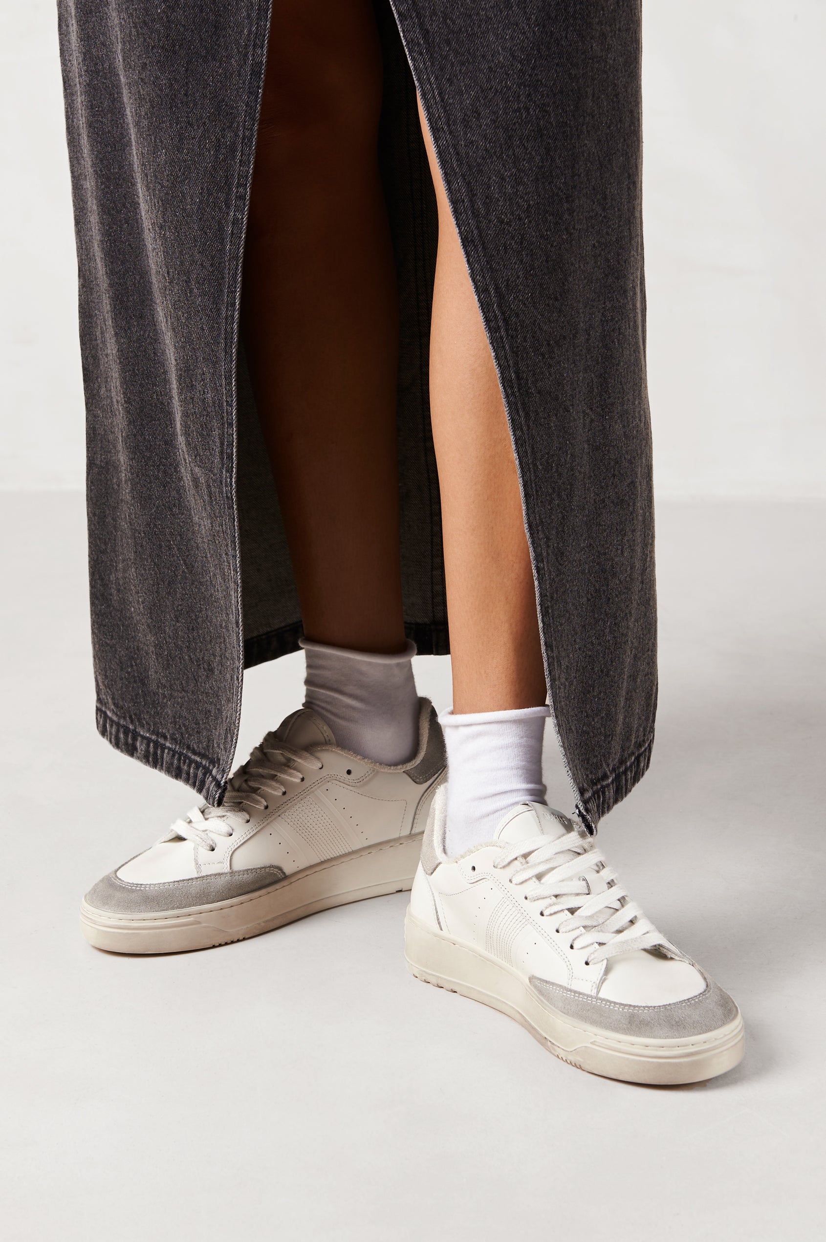 TB.780 low top, lace up sneaker with thick rubber soles, suede panels, and distressing details in Dusty Light Grey - front view on model