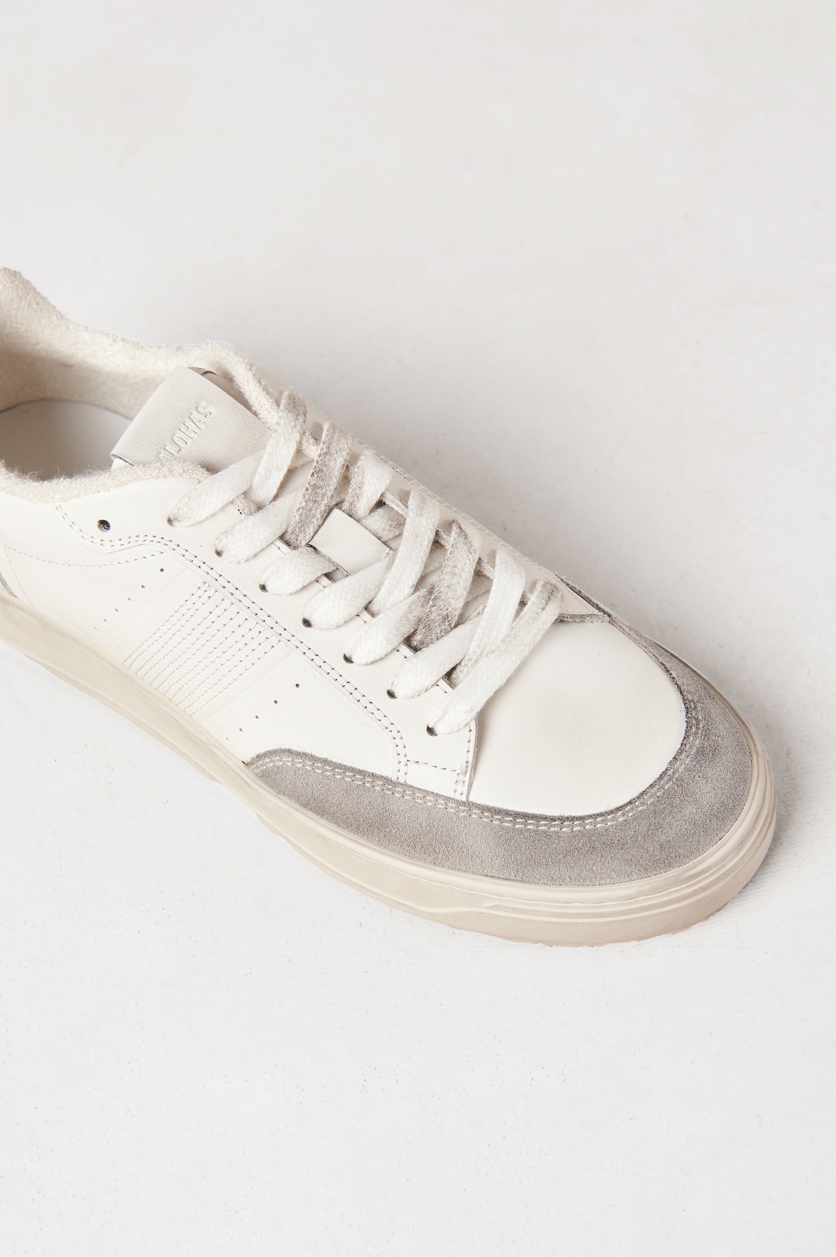 TB.780 low top, lace up sneaker with thick rubber soles, suede panels, and distressing details in Dusty Light Grey - single shoe view shot from above