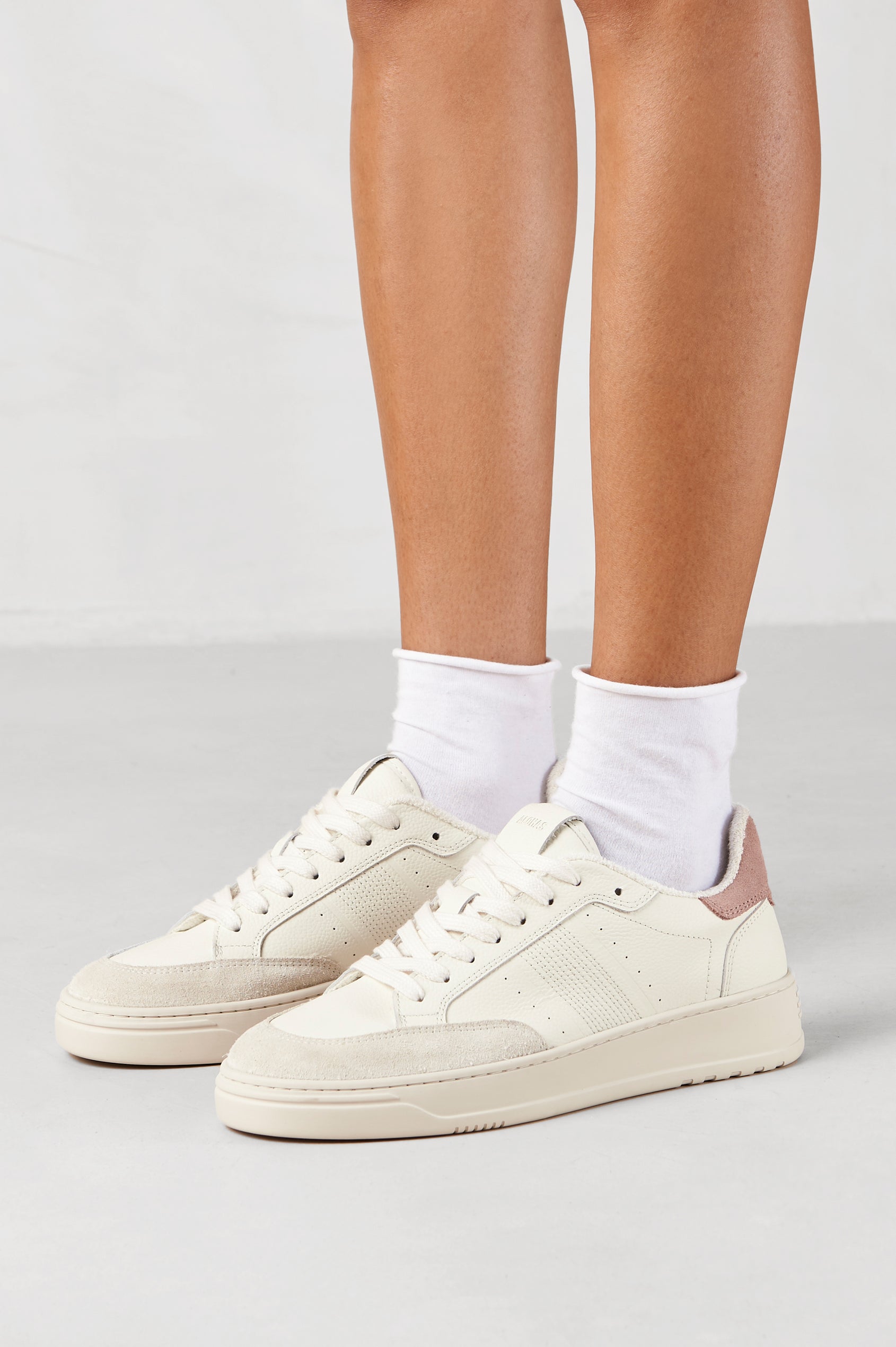 TB.780 low top, lace up sneaker with thick rubber soles, suede panels, and distressing details in Grain Suede Pink -  side view on model