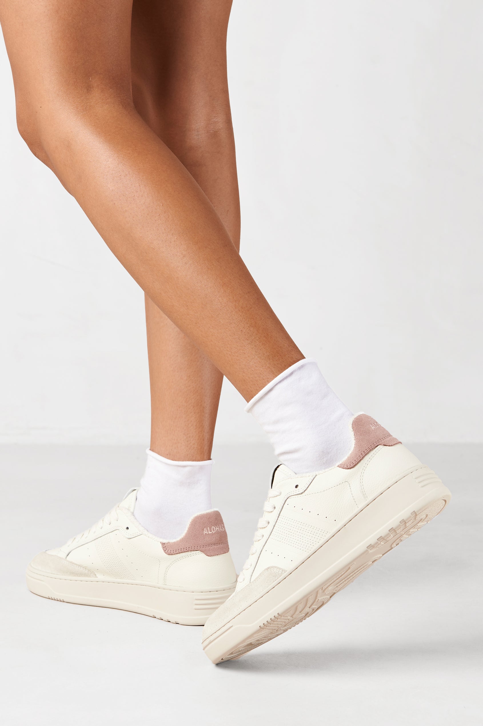 TB.780 low top, lace up sneaker with thick rubber soles, suede panels, and distressing details in Grain Suede Pink - side rear view of shoe pair on model