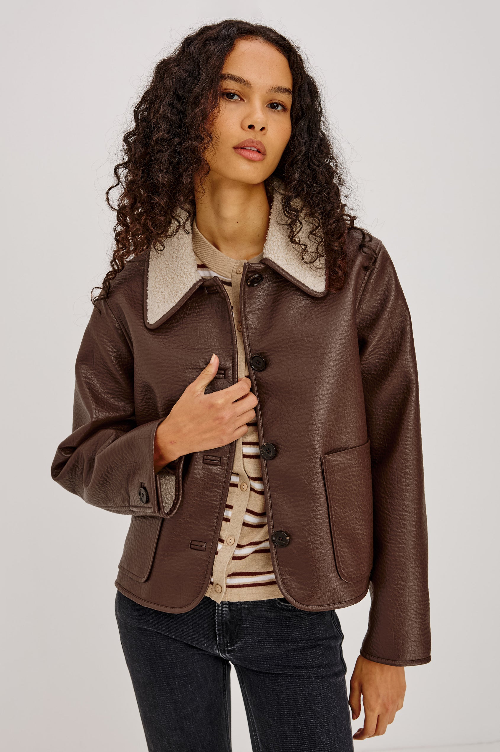 Terra Jacket in Pebbled Vegan Leather With Vegan Shearling Collar and Lining, Slightly Cropped Fit, Front Buttons, and Patch Pockets in Espresso Colorway - Upper Body Front View Featured on Model