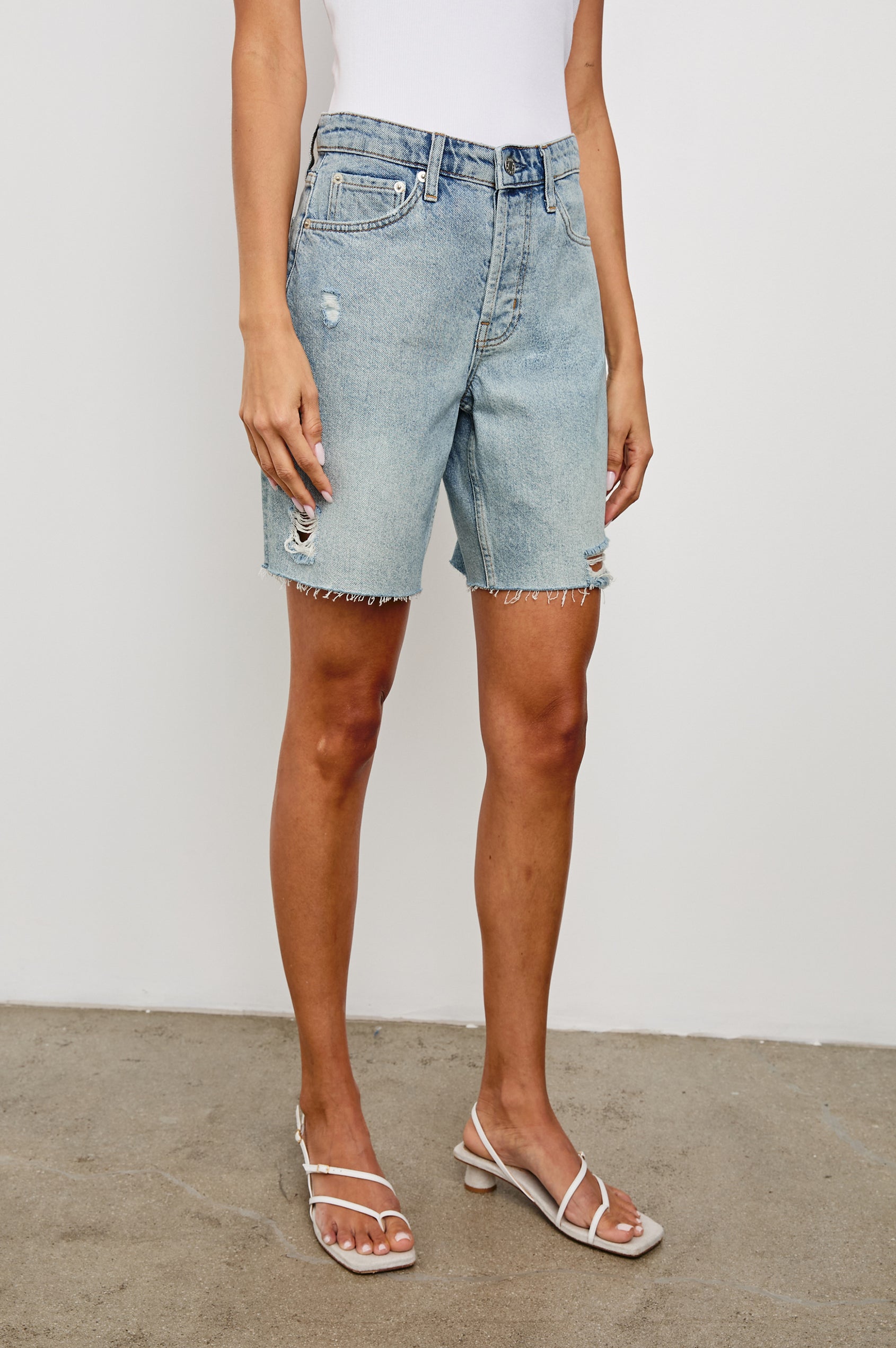Beachwood high rise bermuda length denim short with distressing details in light wash Light Vintage Distress - front view on model, slight angle