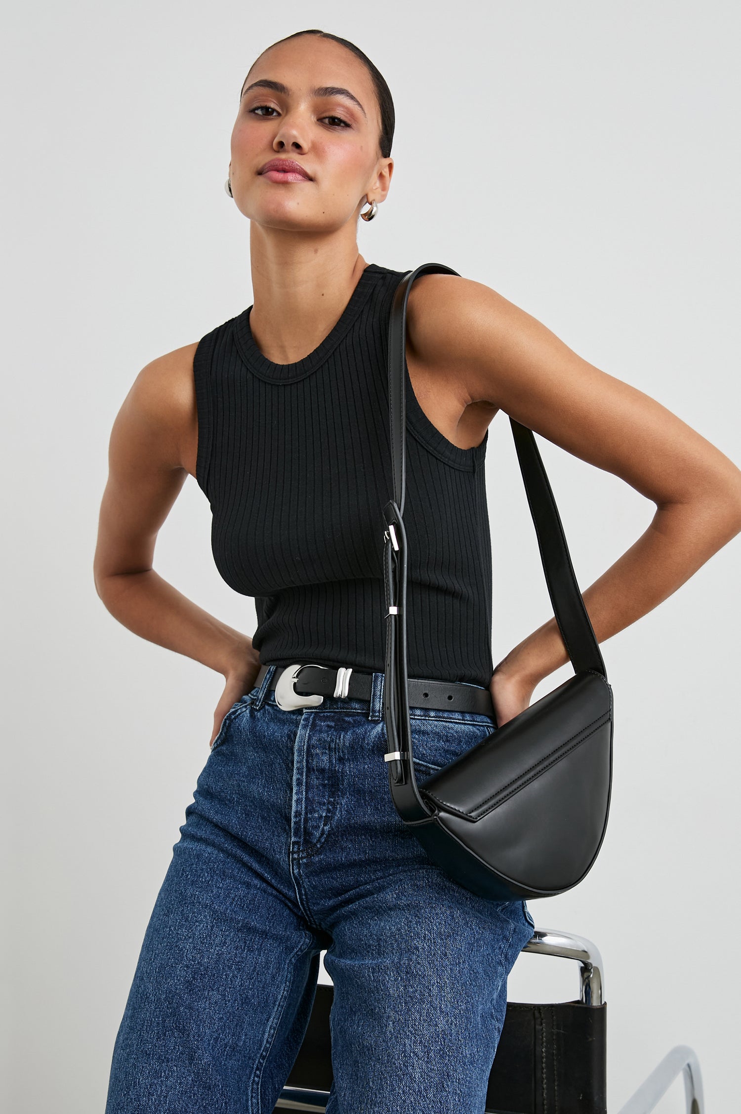 The Racer Ribbed Tank with a Crew Neckline in True Black Colorway - Front View Featured on Model