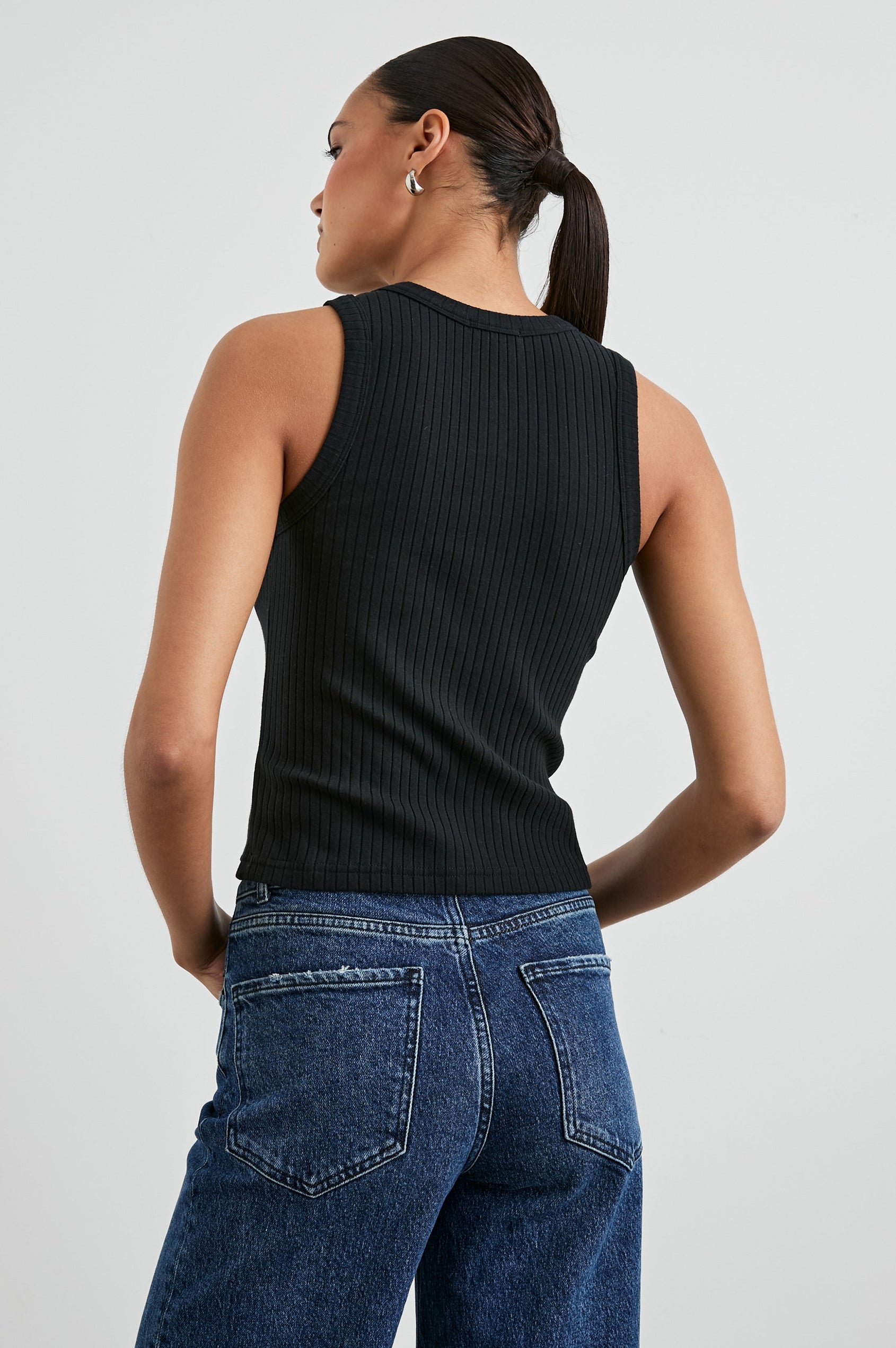 The Racer Ribbed Tank with a Crew Neckline in True Black Colorway - Back View Featured on Model