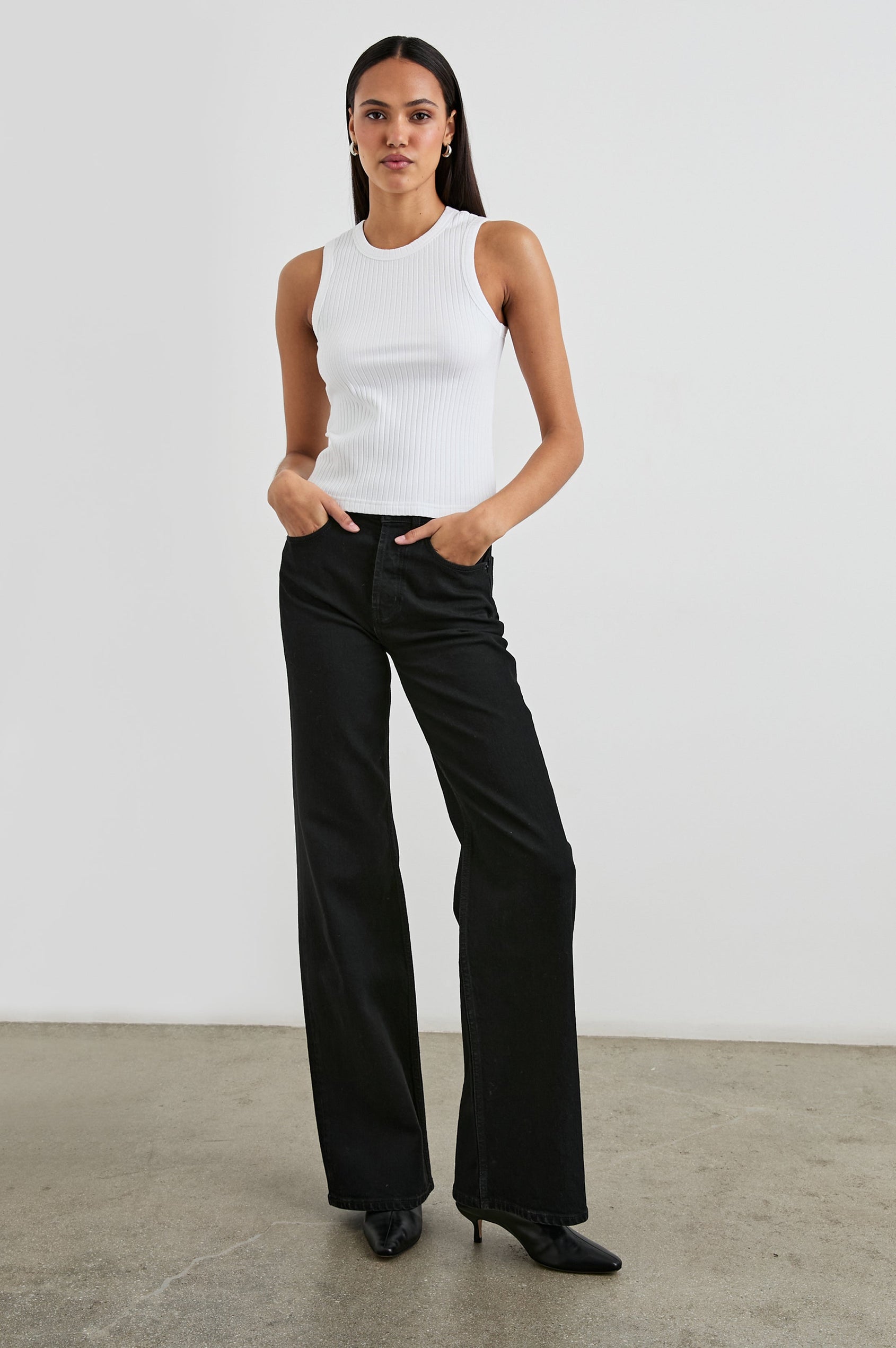 The Racer Ribbed Tank with a Crew Neckline in White Colorway - Front Full Body View Featured on Model