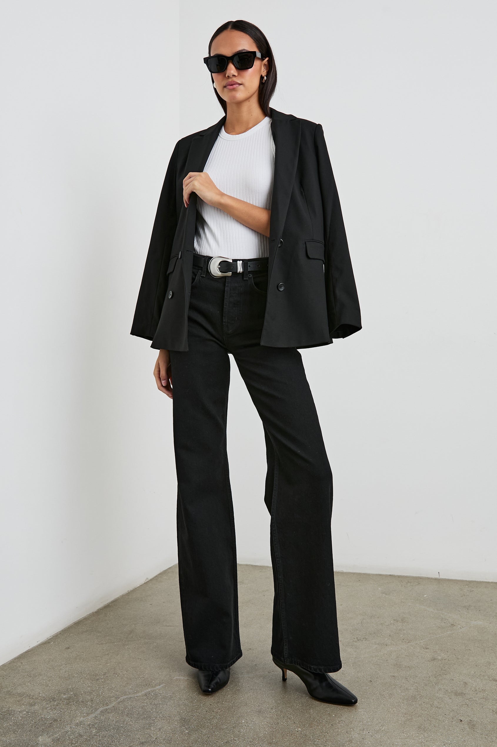 The Racer Ribbed Tank with a Crew Neckline in White Colorway - Front Full Body View Featured on Model