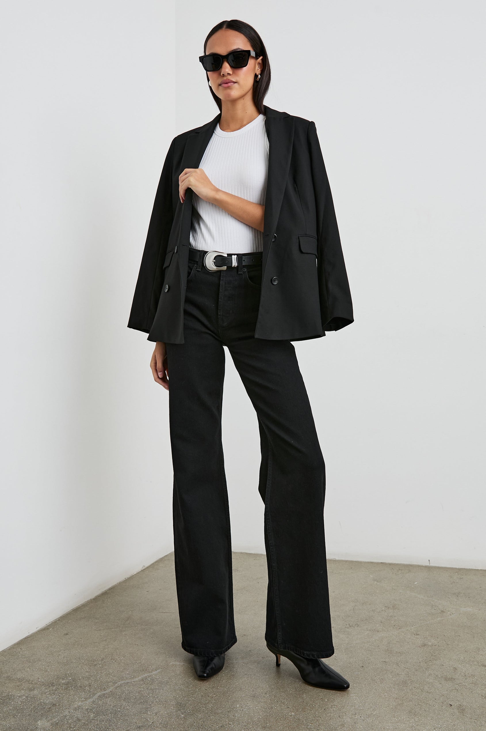 The Racer Ribbed Tank with a Crew Neckline in White Colorway - Front Full Body View Featured on Model