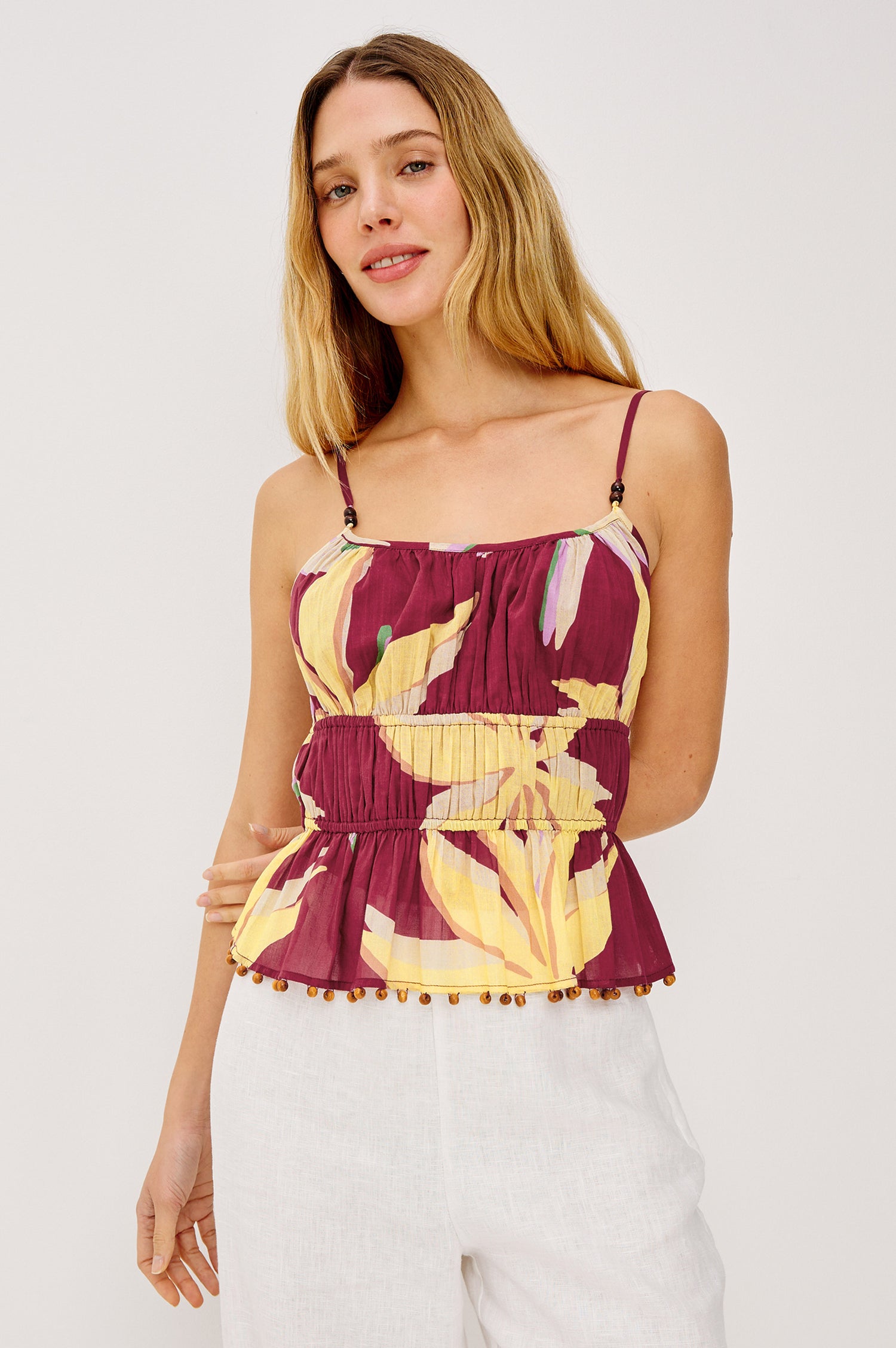 Theda Cropped Tank Top in Cotton Voile With Adjustable Shoulder Straps With Wooden Bead Detailing, and Elastic Tiered Waist in Red Palm Colorway - Upper Body Front View Featured on Model