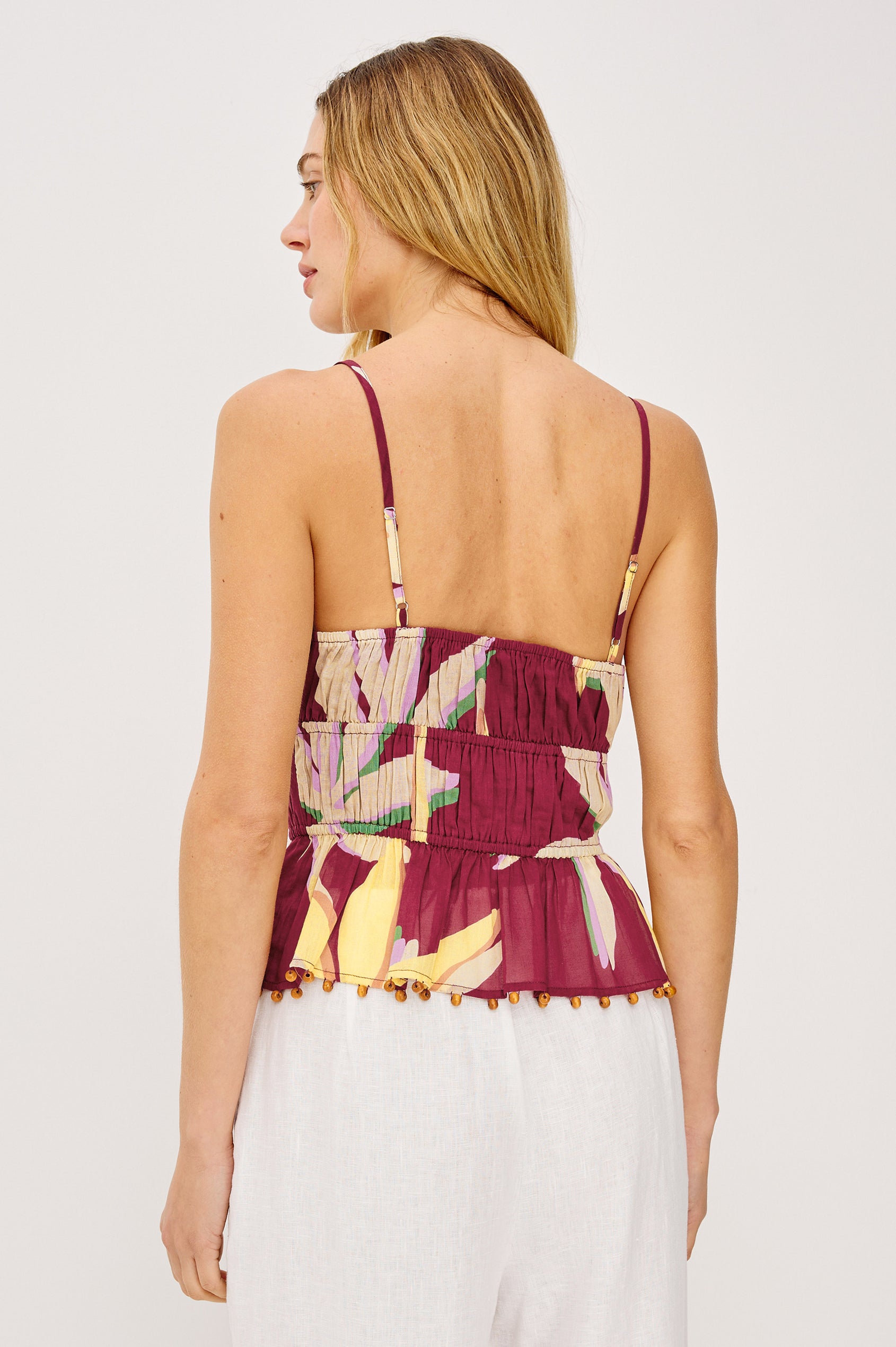 Theda Cropped Tank Top in Cotton Voile With Adjustable Shoulder Straps With Wooden Bead Detailing, and Elastic Tiered Waist in Red Palm Colorway - Upper Body Back View Featured on Model