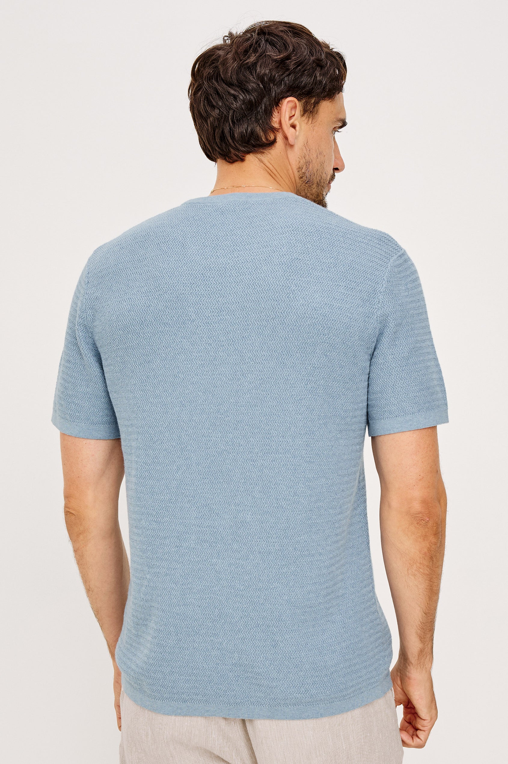 Theo T-Shirt in Ribbed Cotton-Cashmere With Crew Neckline, Short Sleeves, and Classic Fit in Blue Sky Heather Colorway - Upper Body Back View Featured on Model