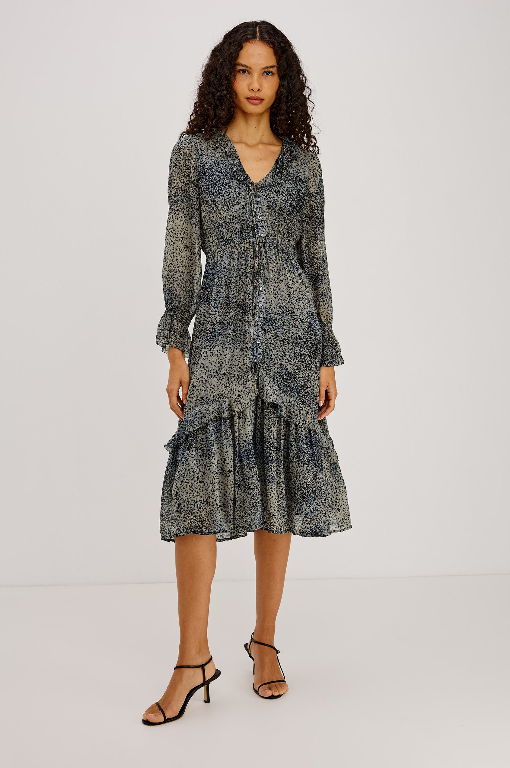 Theresa Midi Dress in Chiffon With Lined Body, Ruffle V-Neckline With Ties, Button-Loop Placket, Elastic Drawstring Waist, Long Semi-Sheer Bishop Sleeves, and Asymmetric Tier at Skirt in Agate Colorway - Full Body Front View Featured on Model