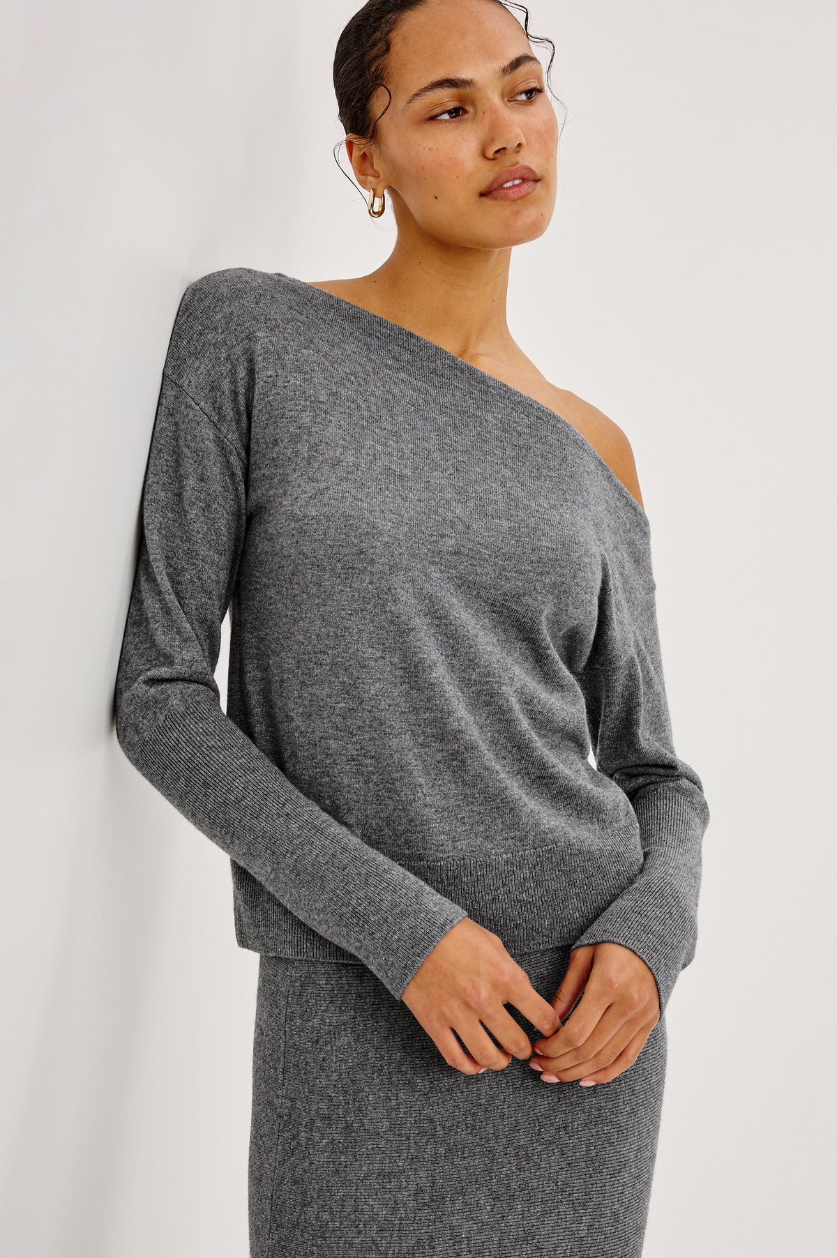 Tianna Sweater in Wool Blend With Off-Shoulder Neckline and Long Sleeves in Heather Charcoal Colorway - Front Crop View Featured on Model.